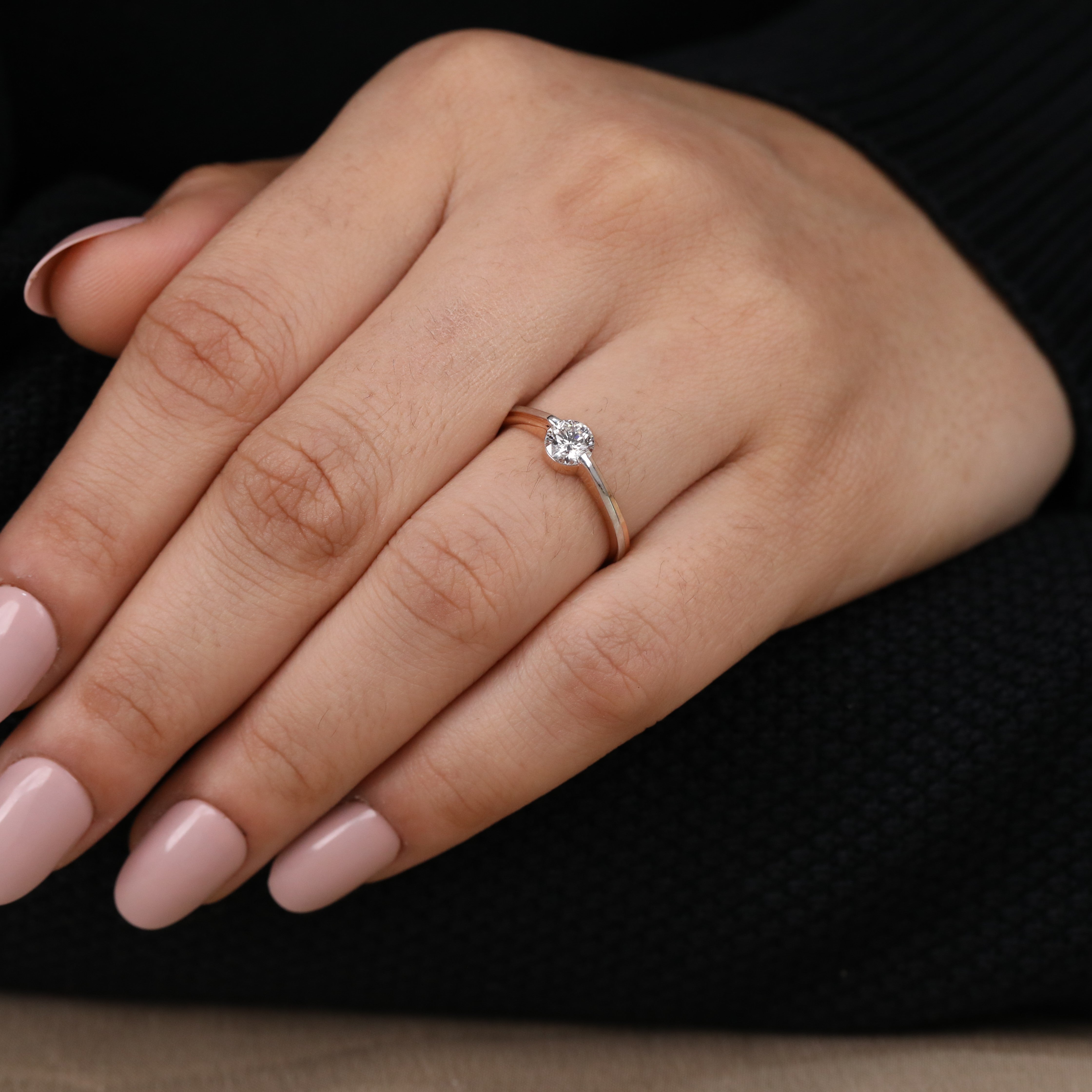 Stylish two tone ring showcasing a brilliant round lab grown diamond center