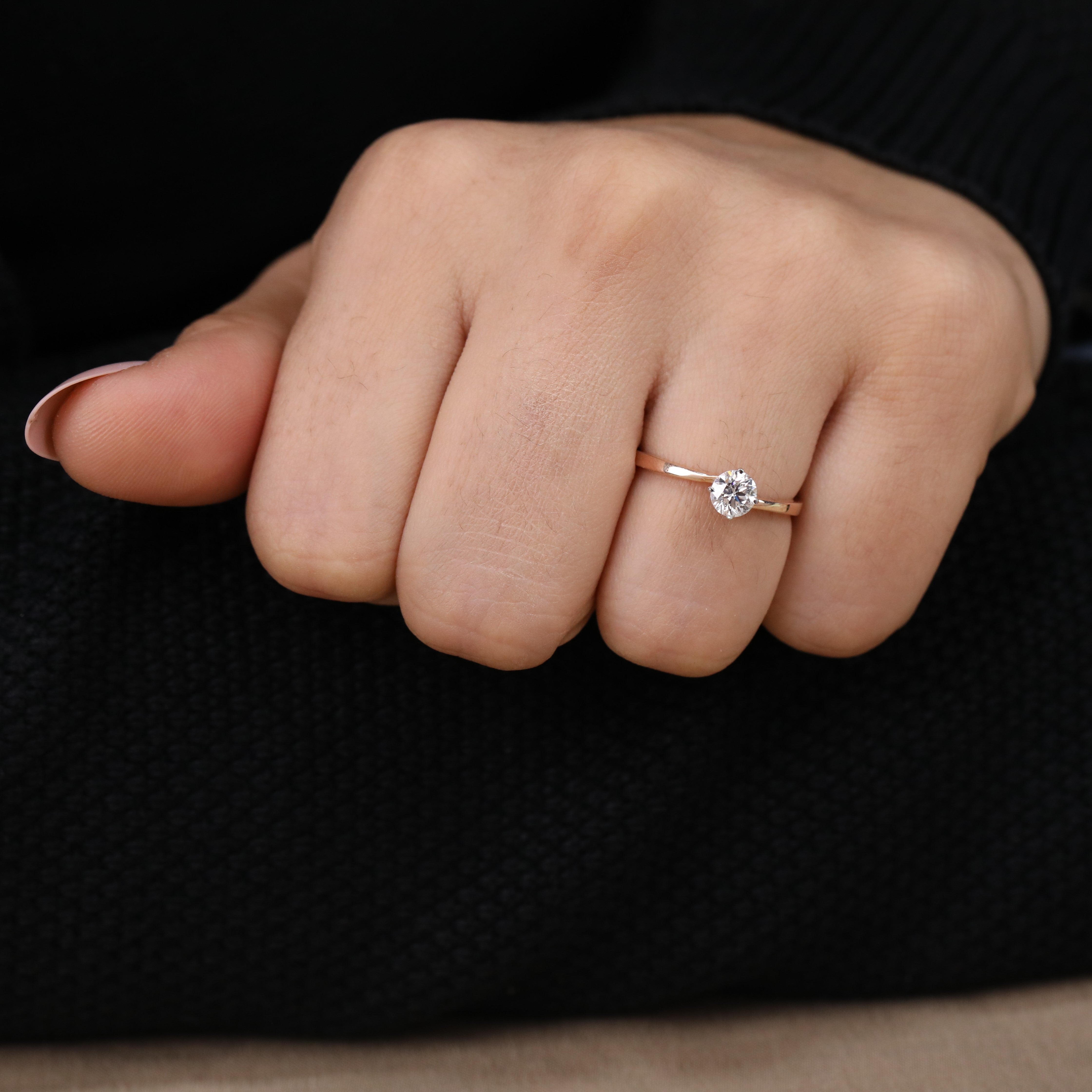 Minimalist solitaire ring highlighting a radiant round ethical lab grown diamond