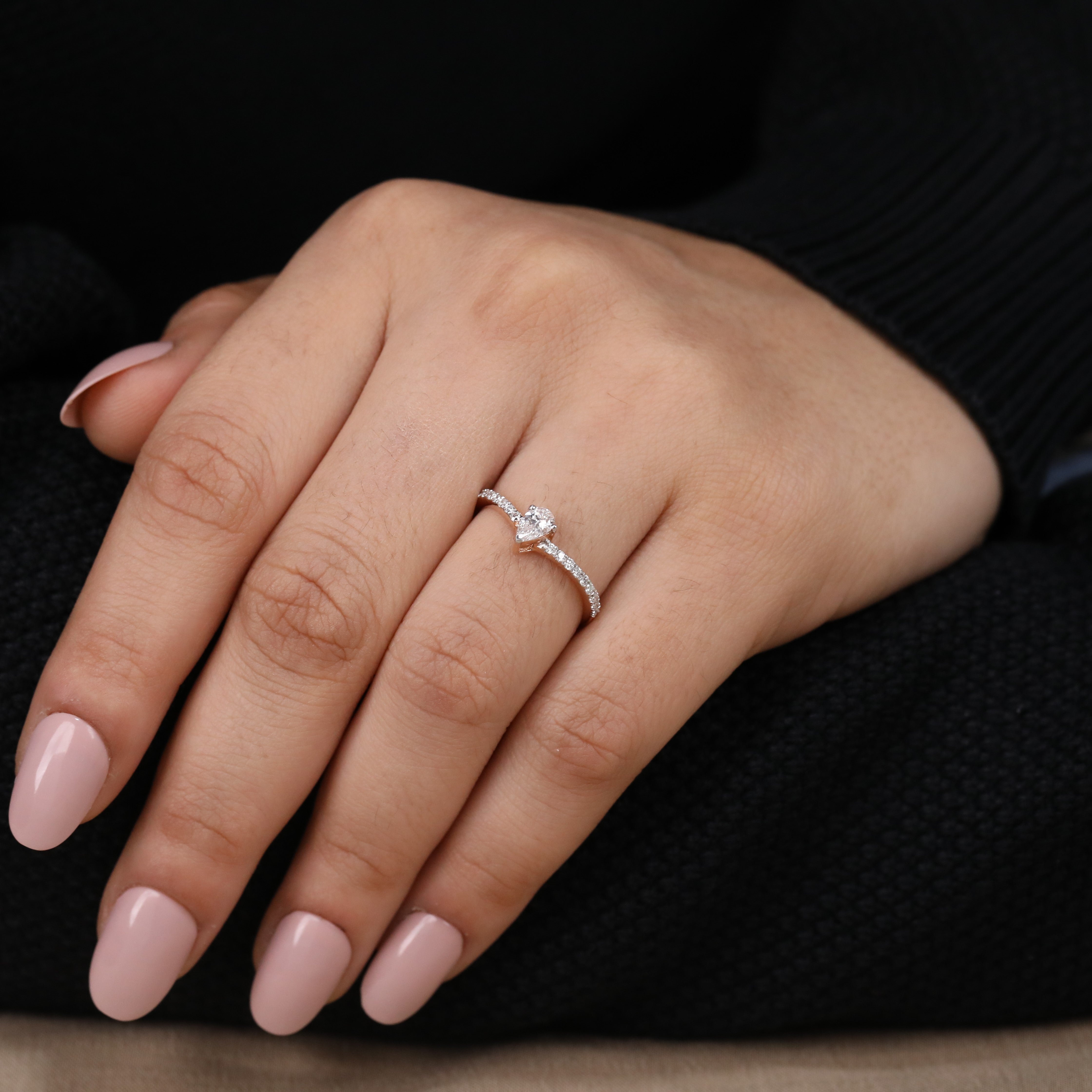 Modern bridal ring with a radiant pear lab grown diamond and pavé band