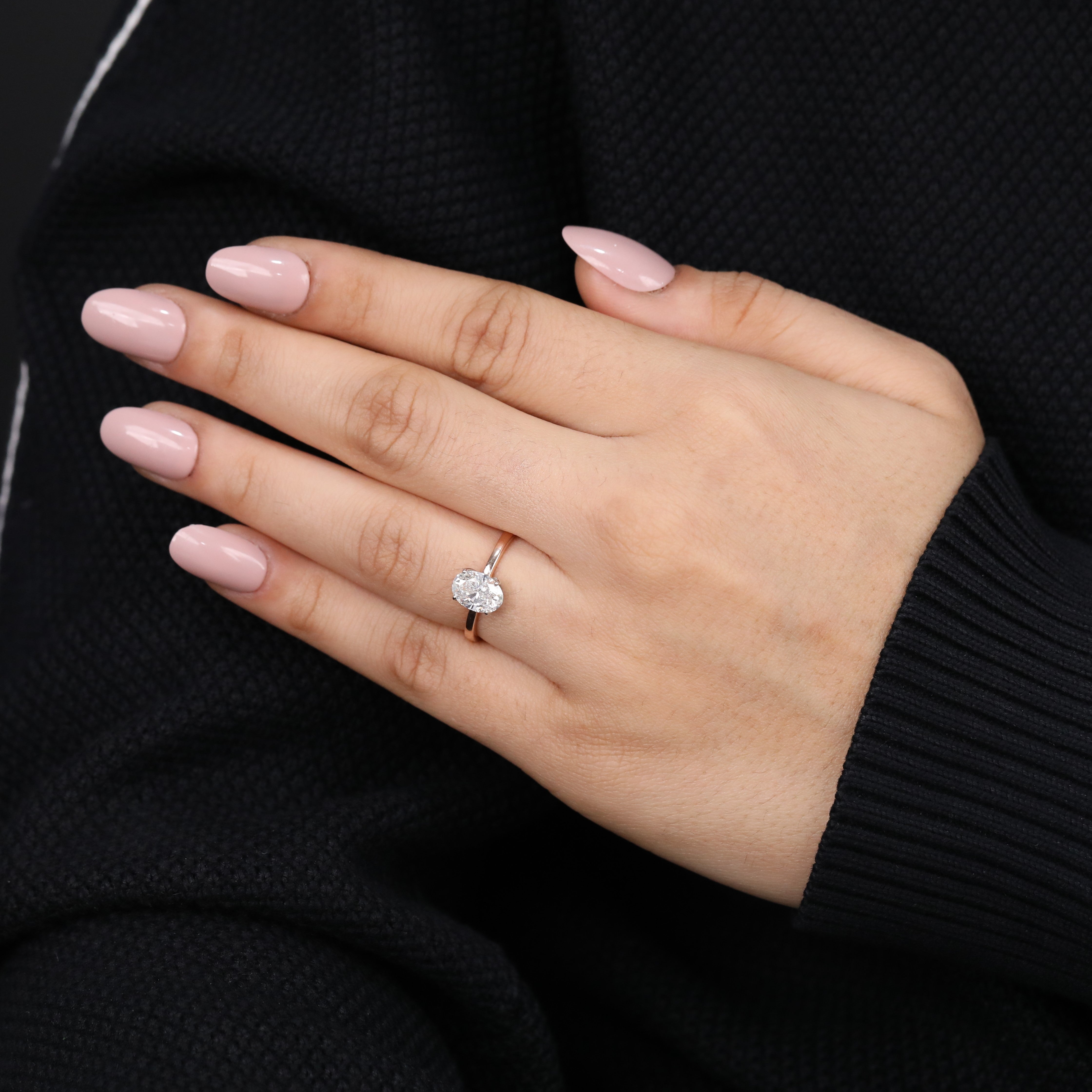 Beautiful ring featuring a sparkling oval lab grown diamond in prong setting