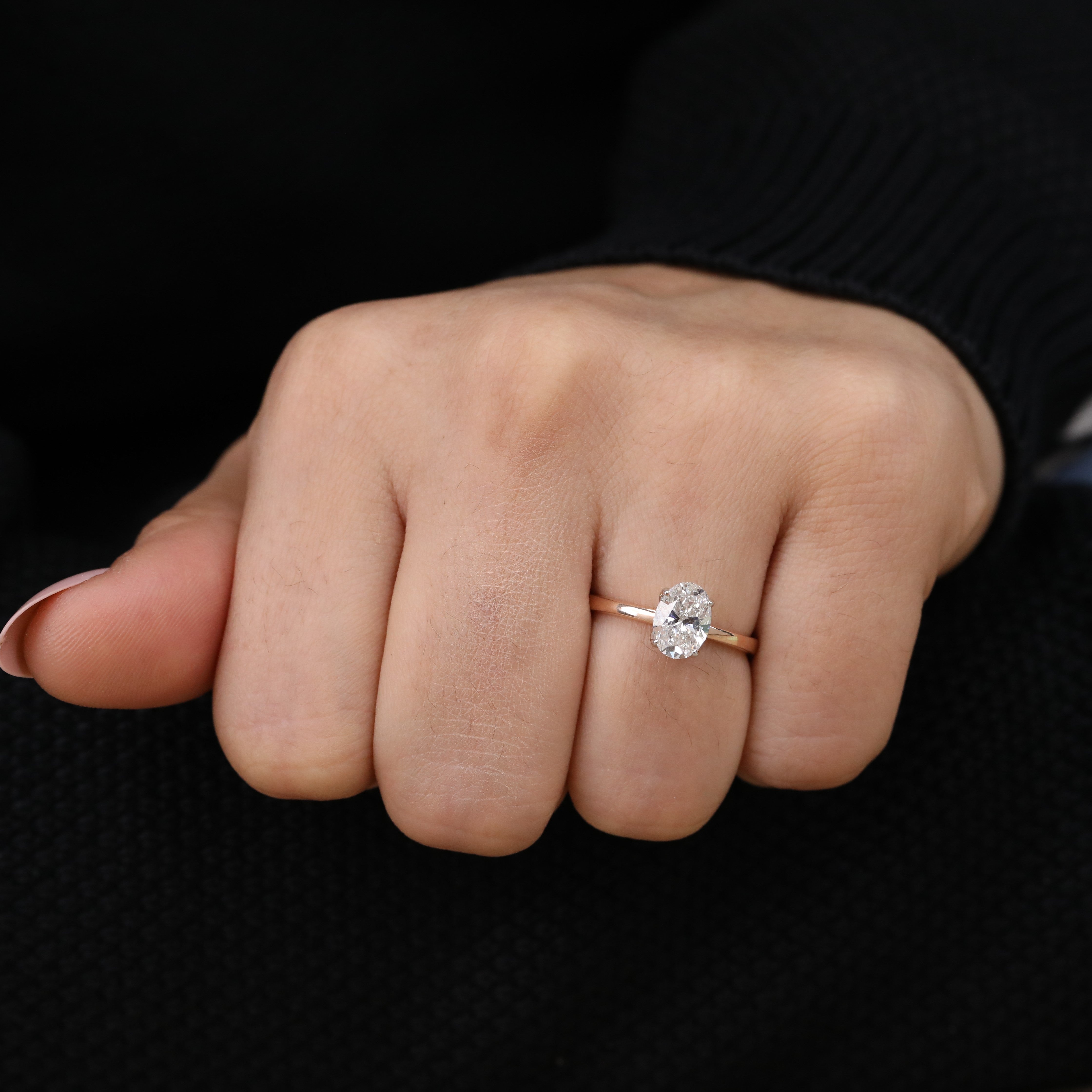 Refined solitaire design showcasing a bright oval lab grown diamond stone