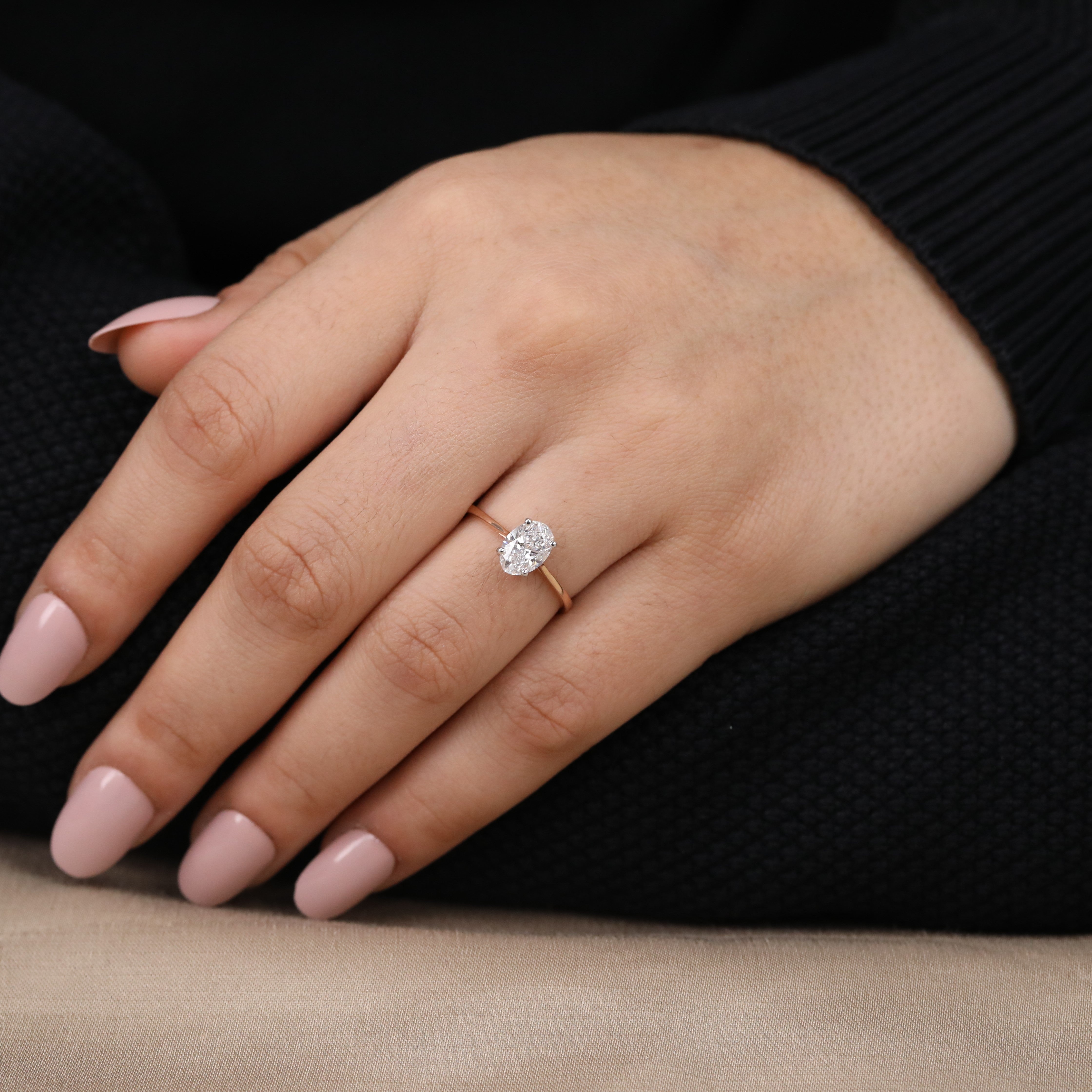 Beautiful minimalist ring featuring a radiant oval lab grown diamond center.