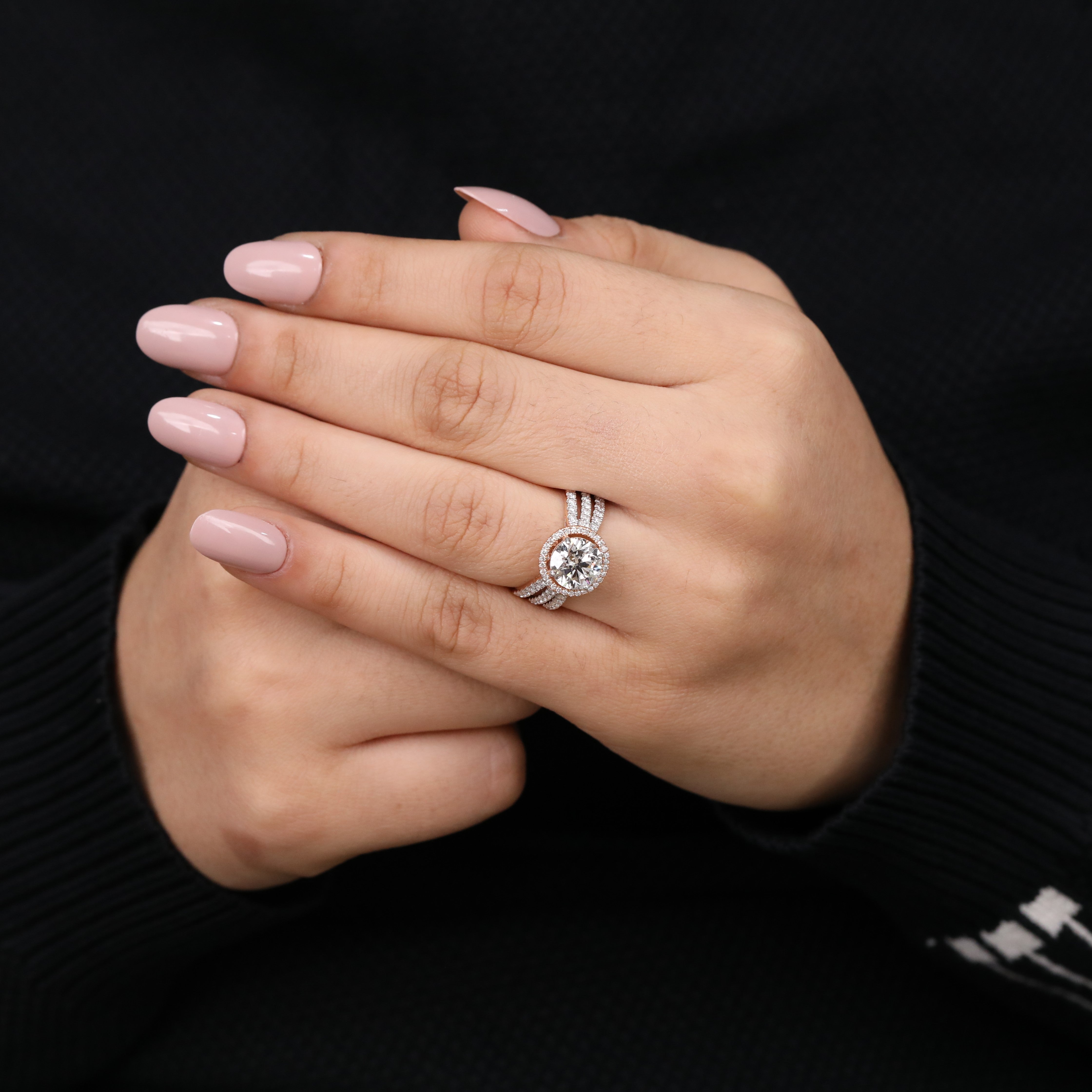 Dazzling halo ring highlighting a bright round lab grown diamond and side rows