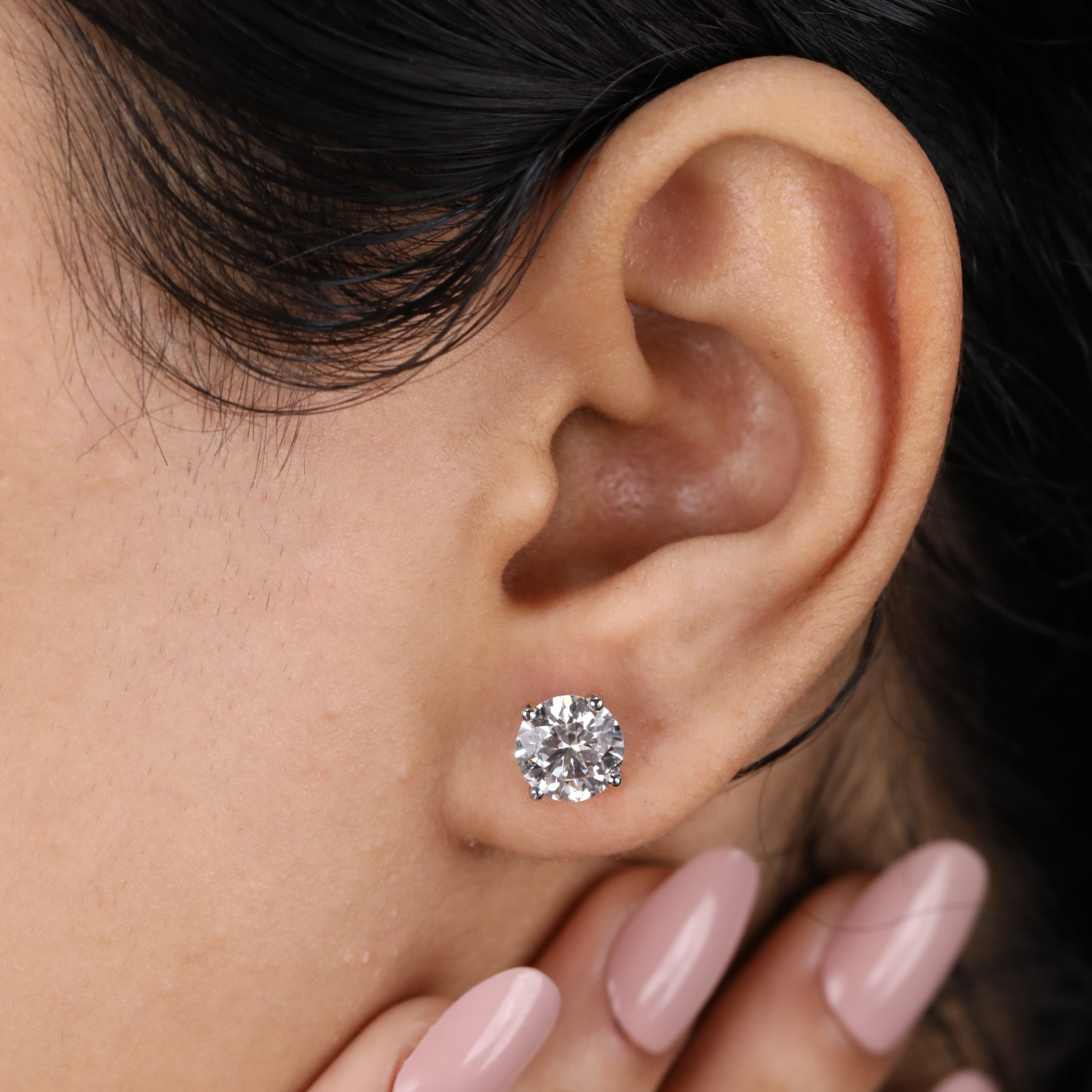 Elegant round diamond earrings for women, suitable for wedding and festive wear.