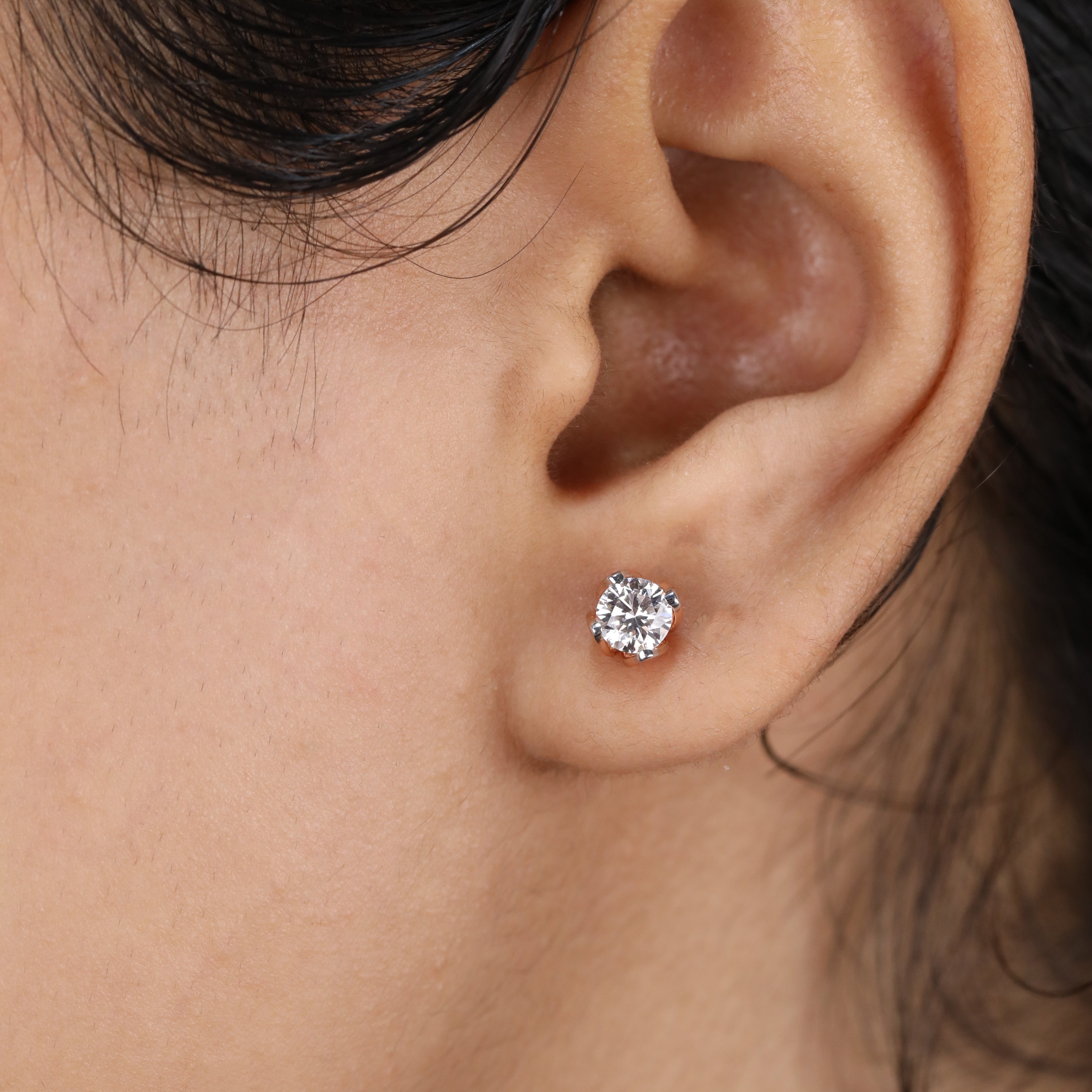 Round diamond stud earrings designed for anniversary surprises and romantic moments