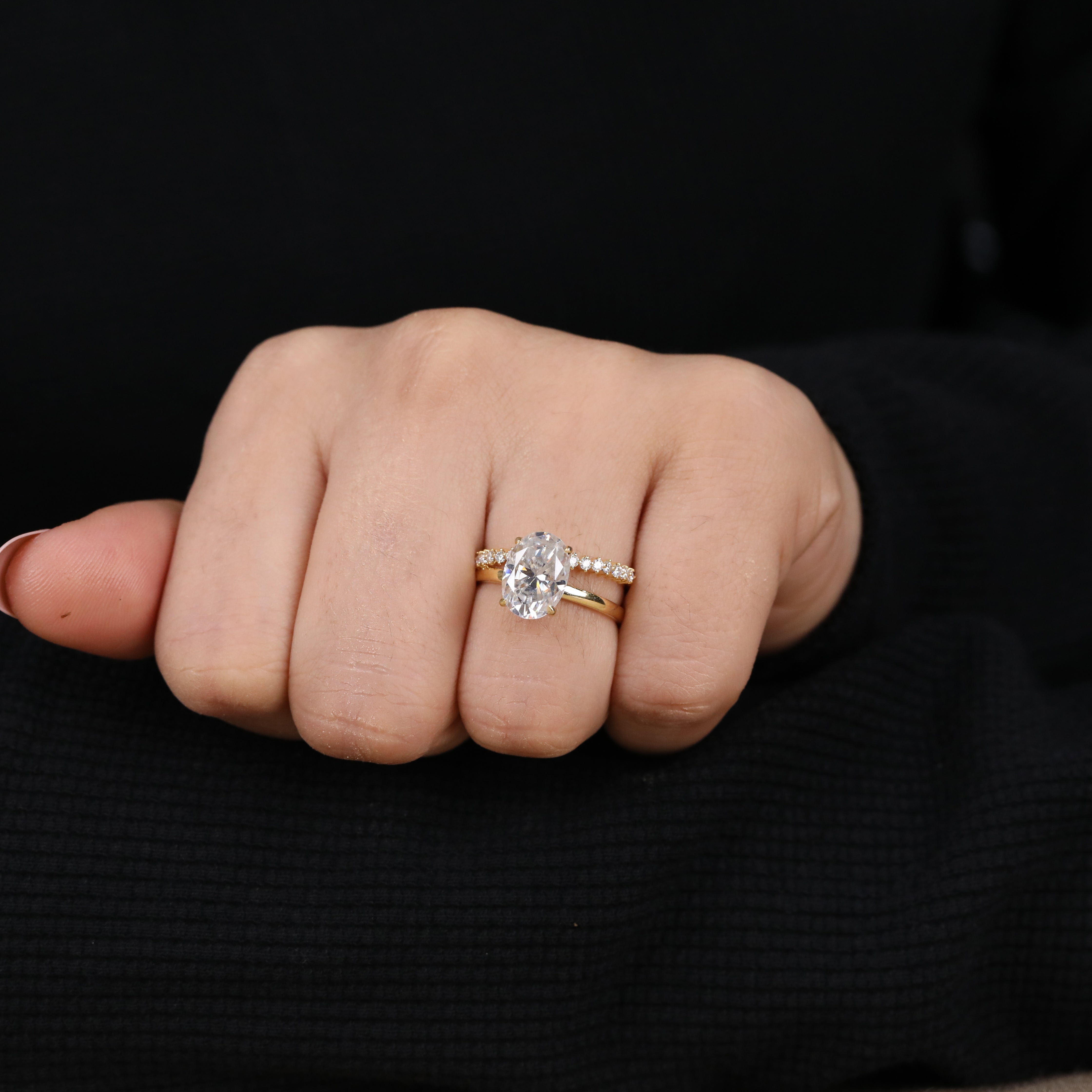 Modern oval lab-grown diamond bridal set with shimmering side stones.