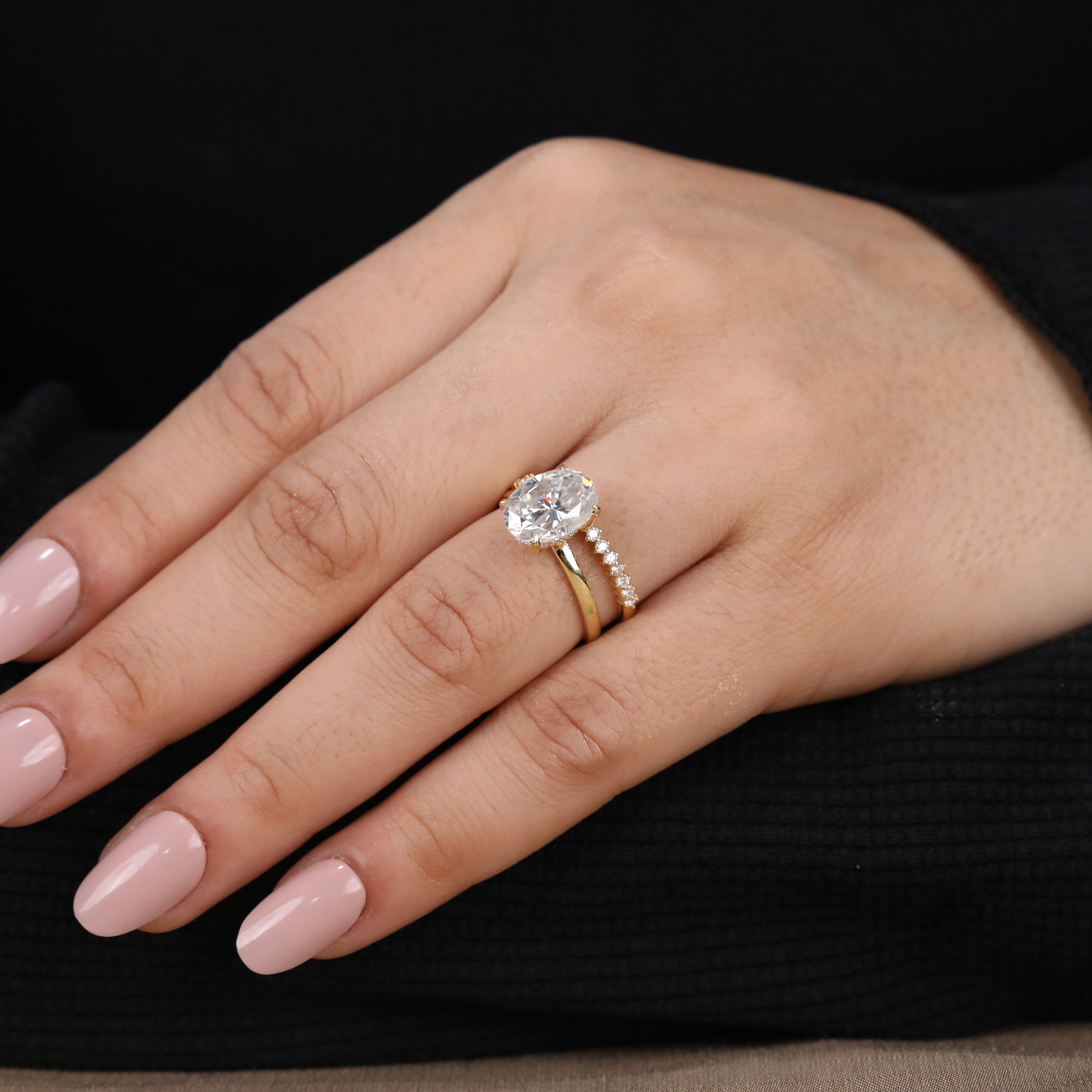 Oval lab diamond ring set designed with a classic solitaire and pavé enhancer band.