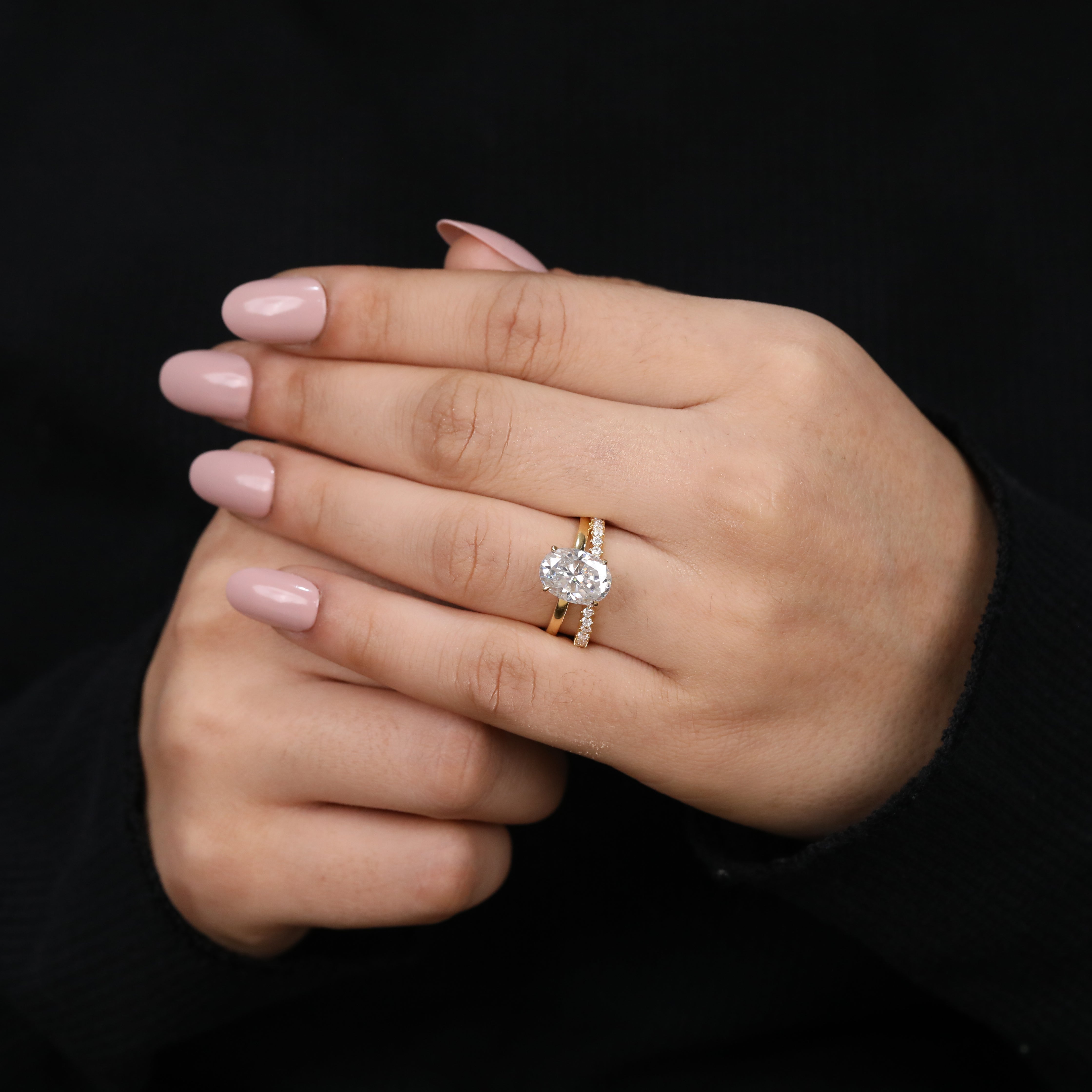 Luxurious oval lab-grown diamond bridal set showcasing brilliant sparkle.