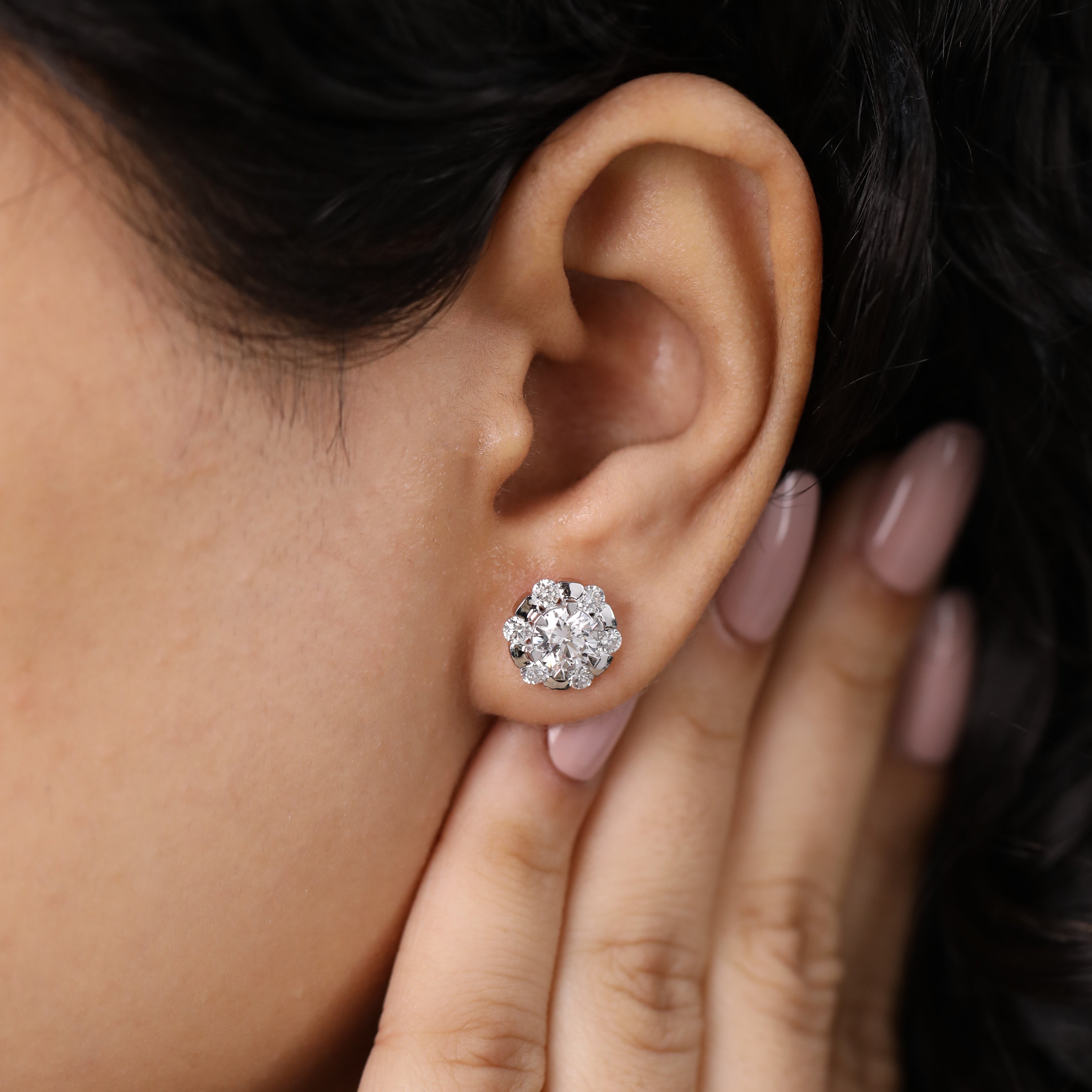 Charming round diamond cluster earrings perfect for engagement and festive moments.