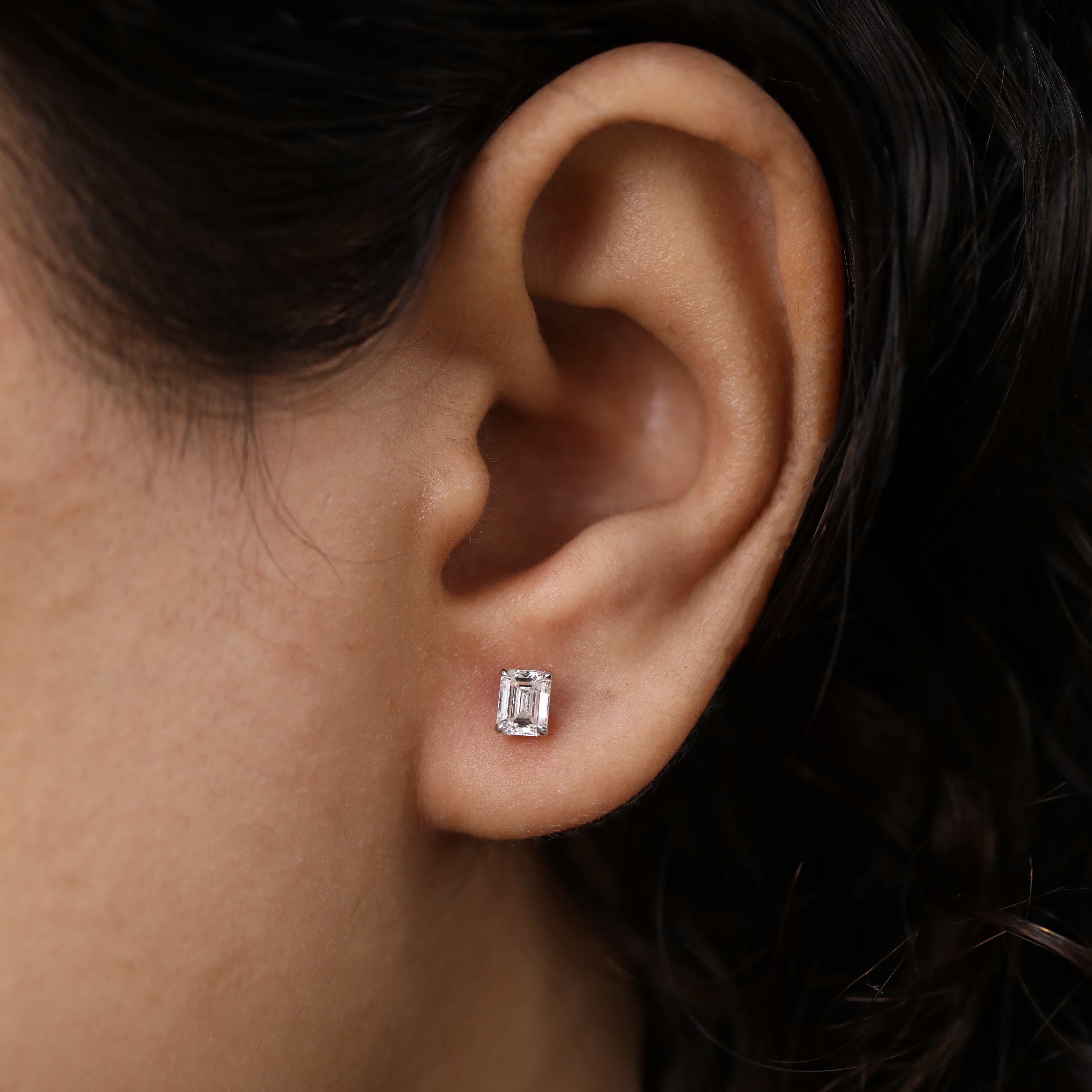 Emerald cut diamond stud earrings designed for bridal or anniversary moments.