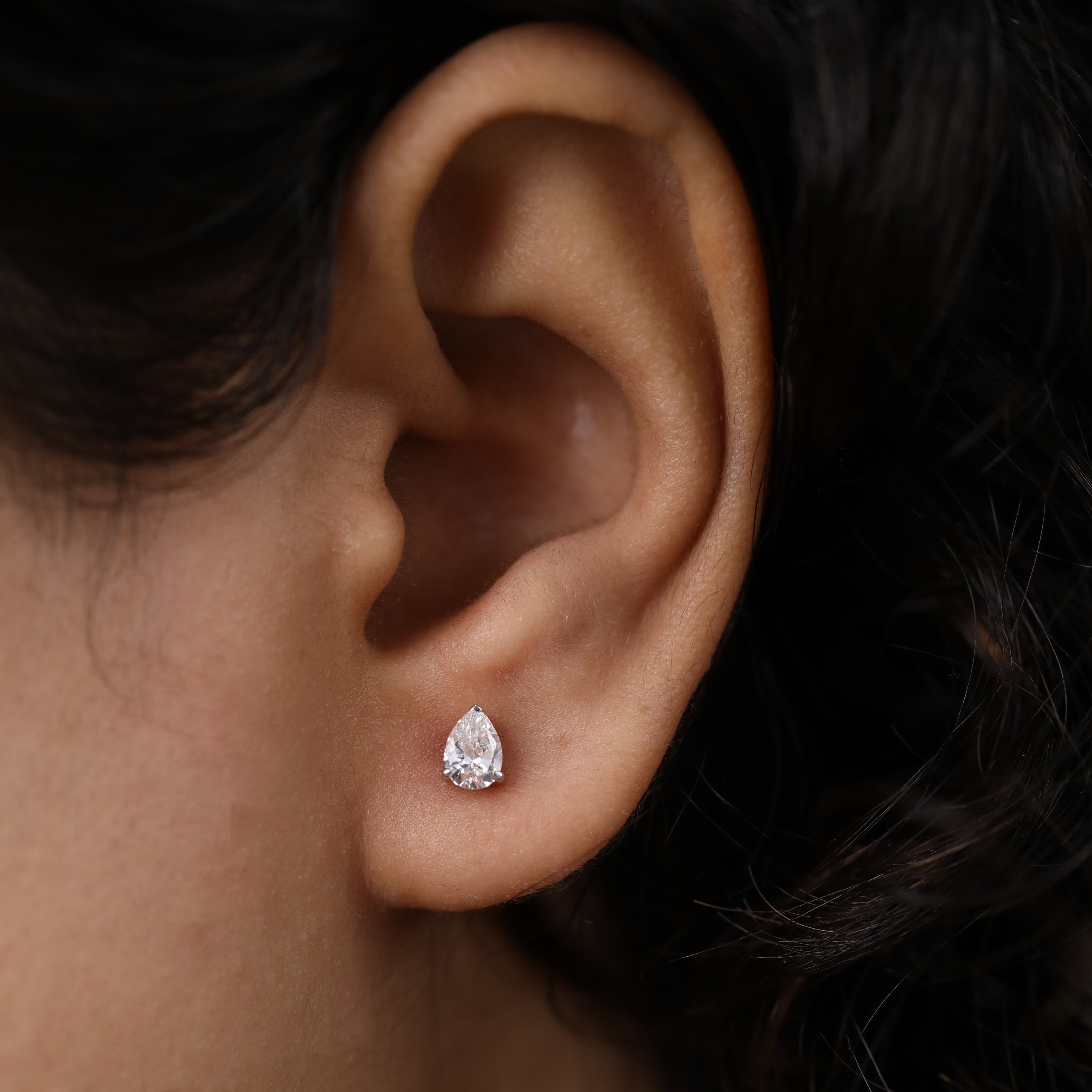 Sparkling pear diamond earrings perfect for engagement or anniversary moments.