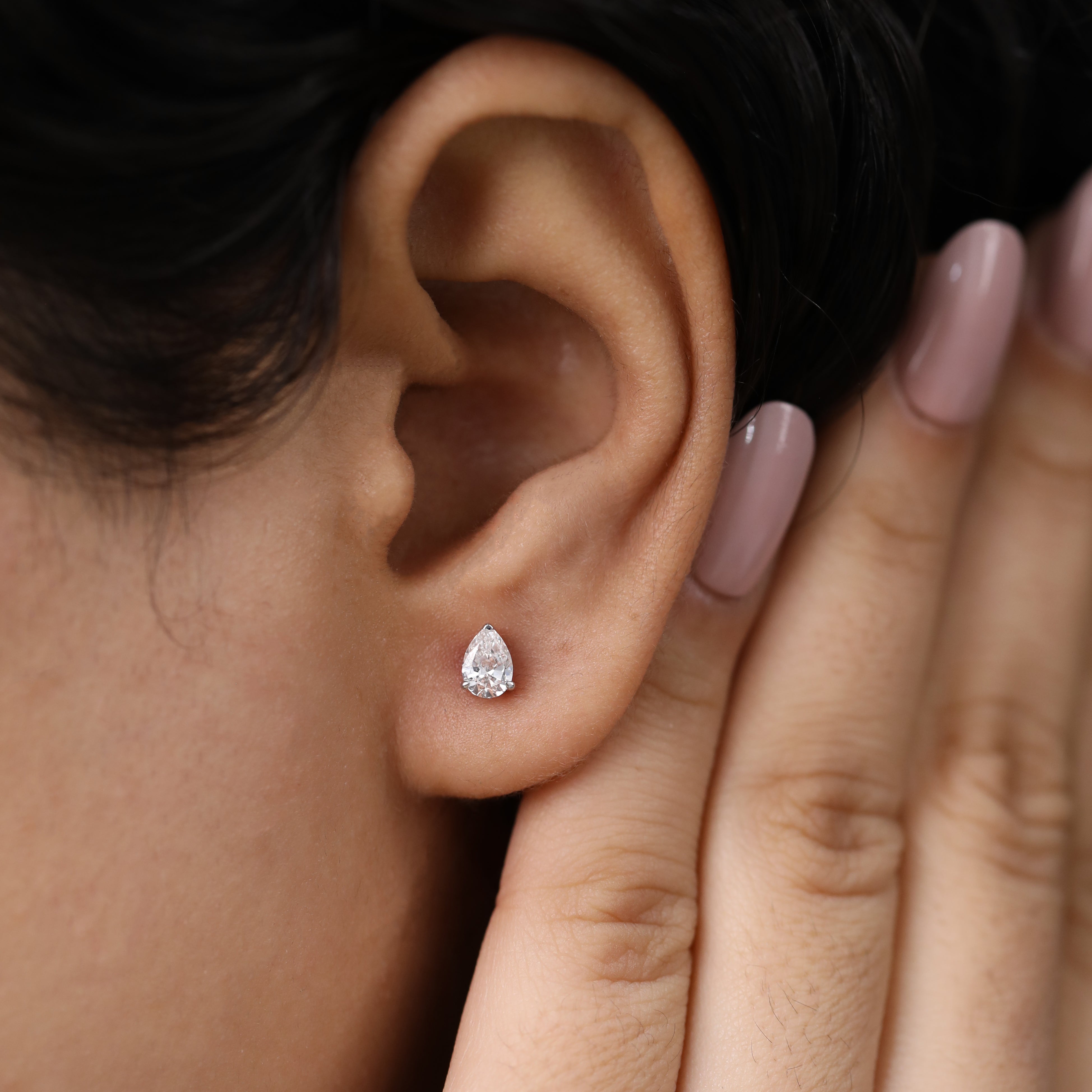 Timeless pear-shaped diamond studs ideal for party wear or gifting.