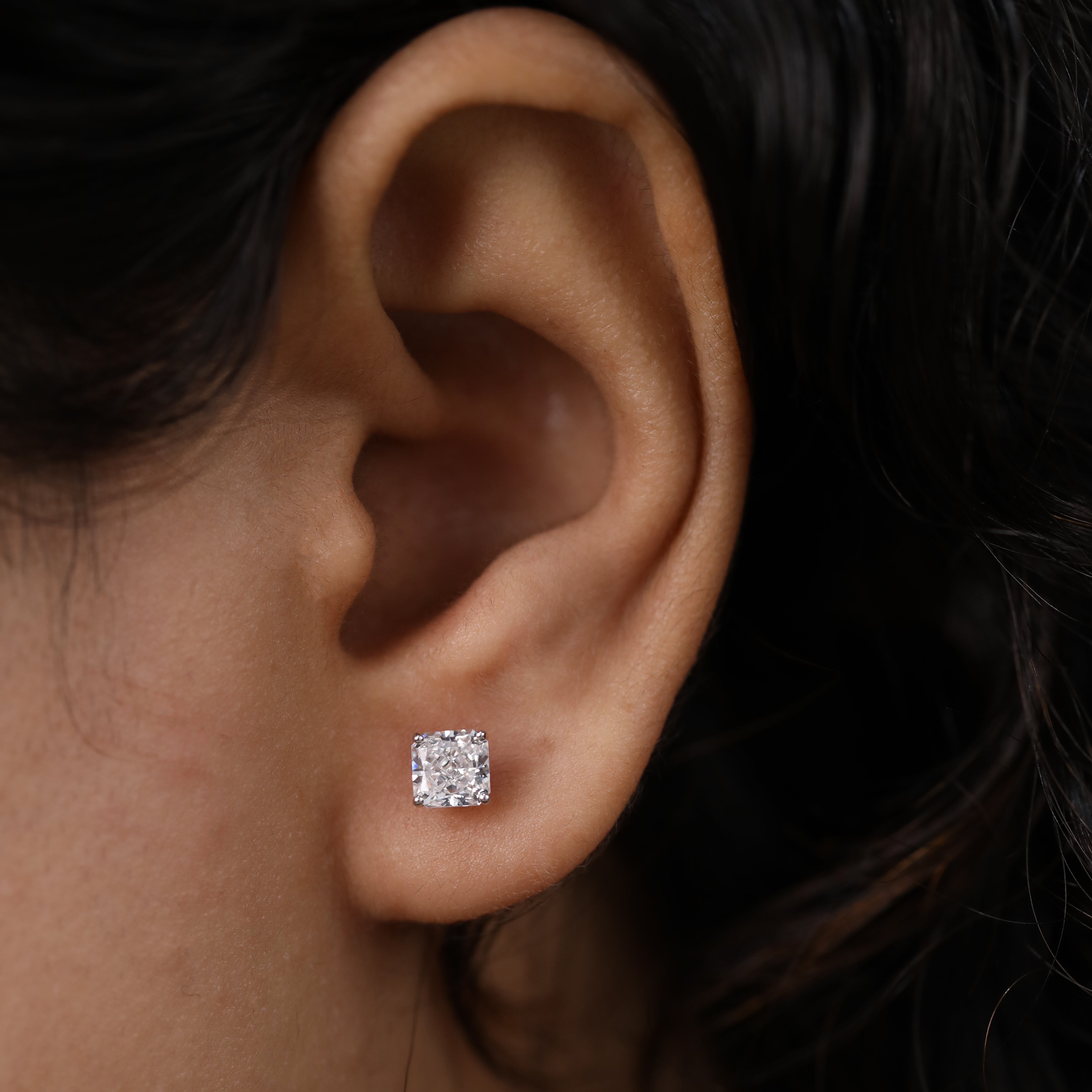 Timeless cushion diamond studs ideal for engagement or anniversary moments.