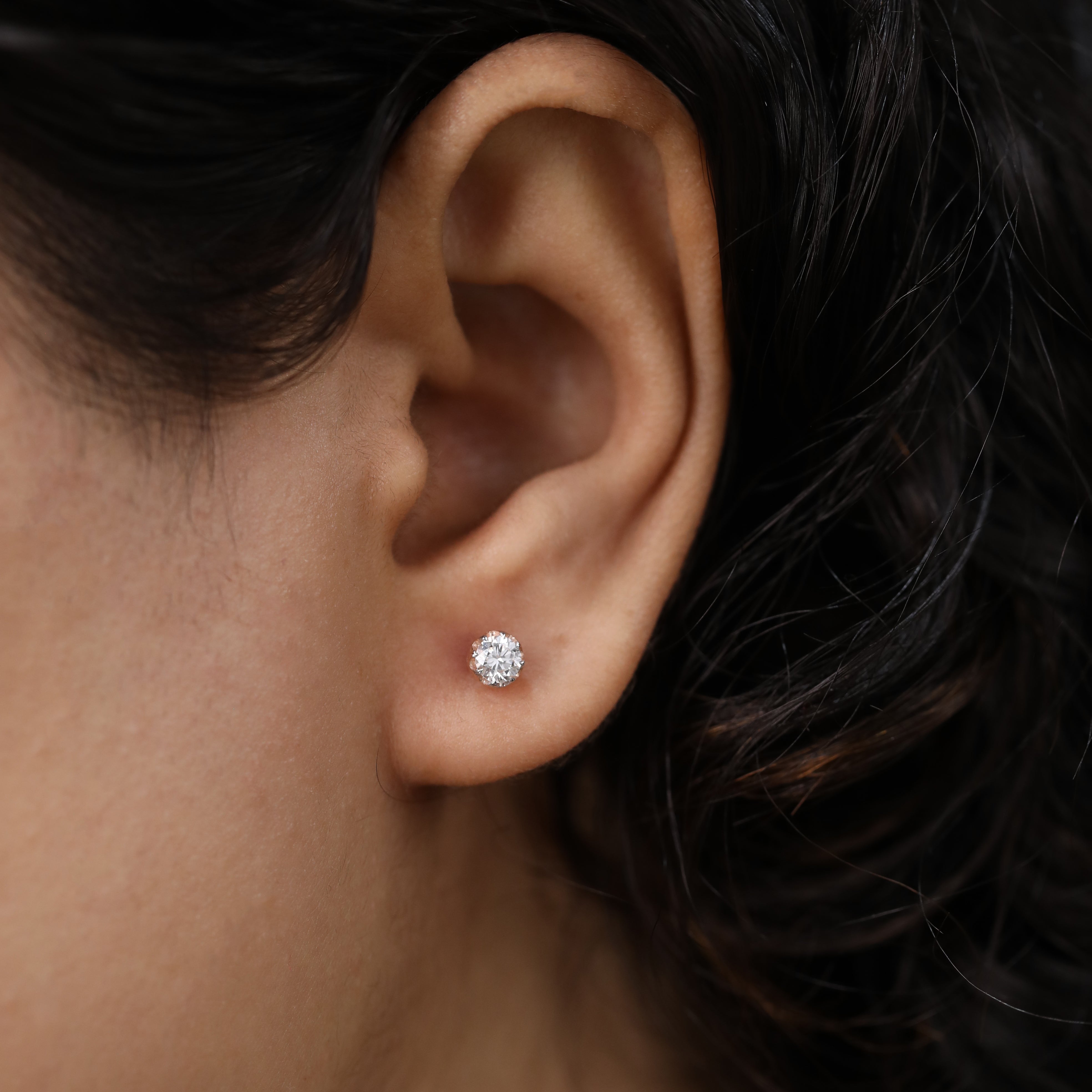 Timeless round diamond studs ideal for party wear or celebration events.