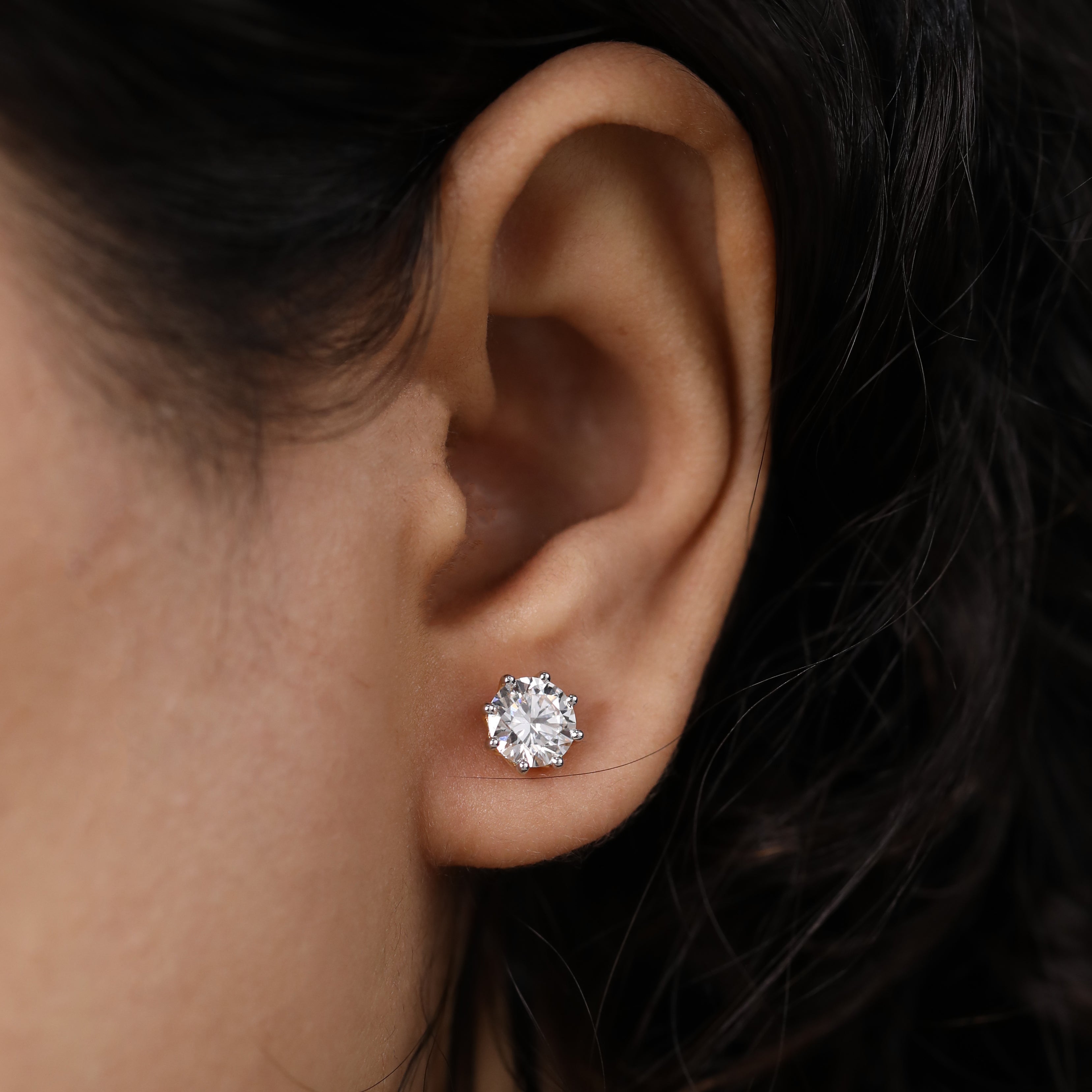 Sparkling round diamond earrings suited for wedding and birthday celebrations.