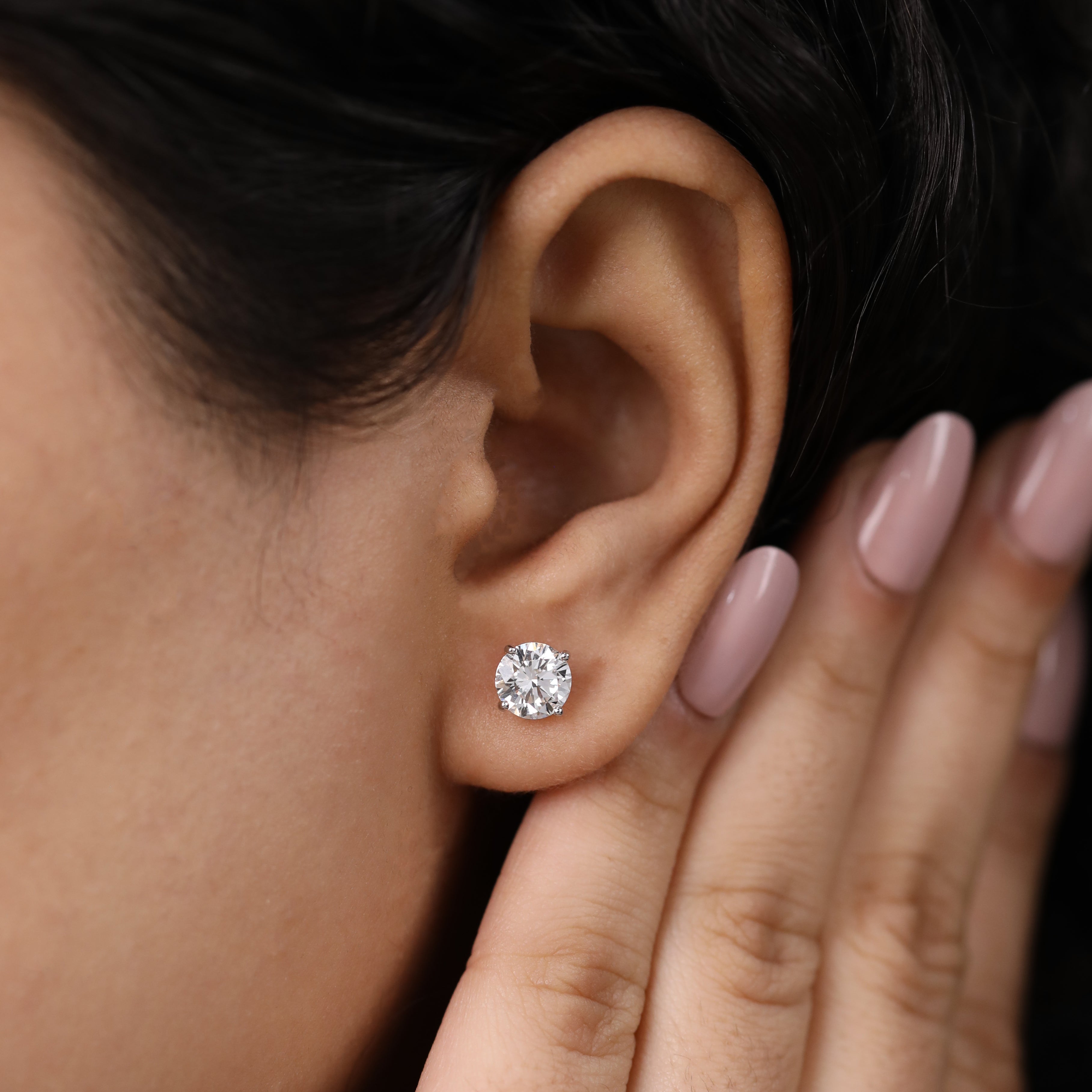 Stylish round diamond earrings suited for party or festive wear.
