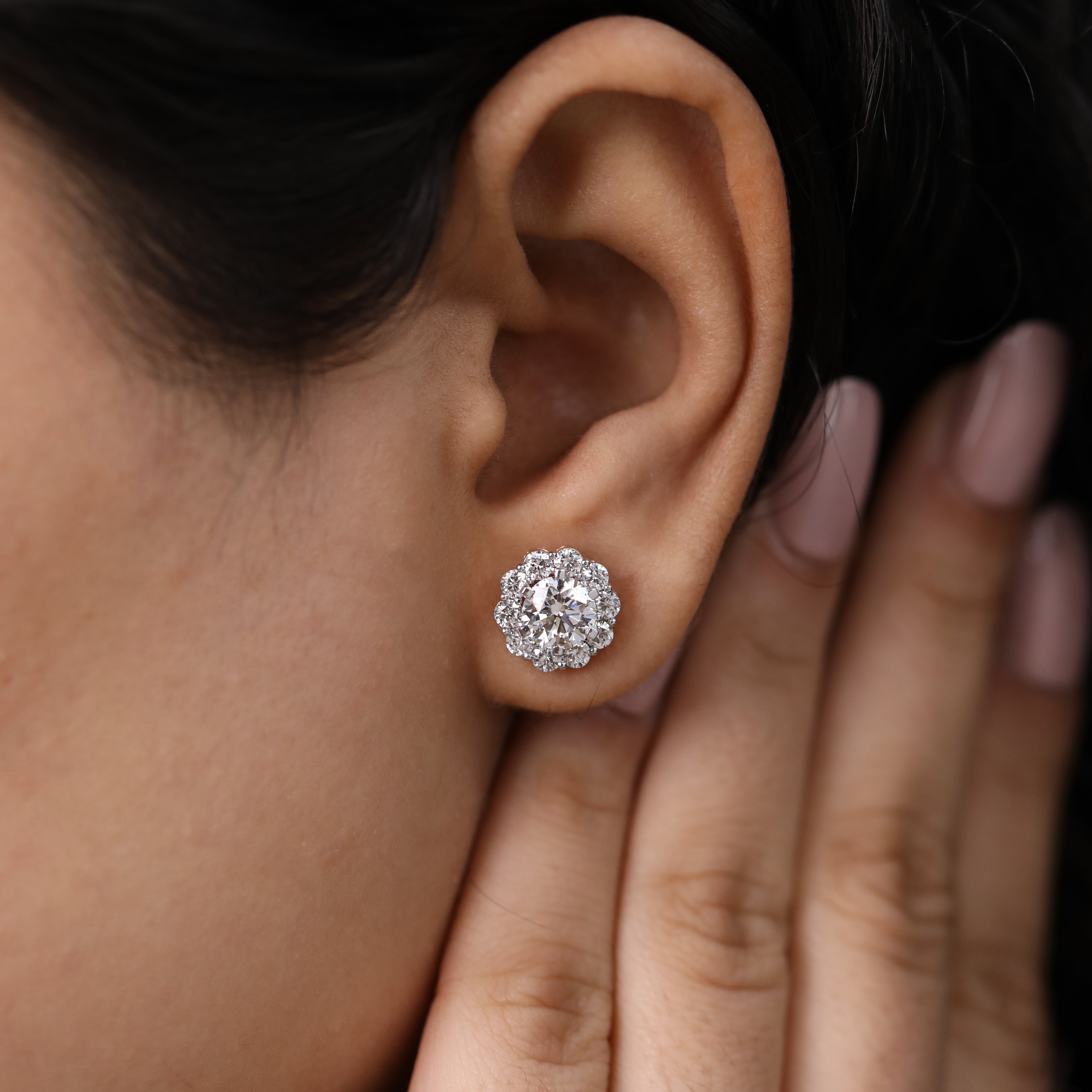 Luxury round floral halo diamond studs ideal for anniversary style.