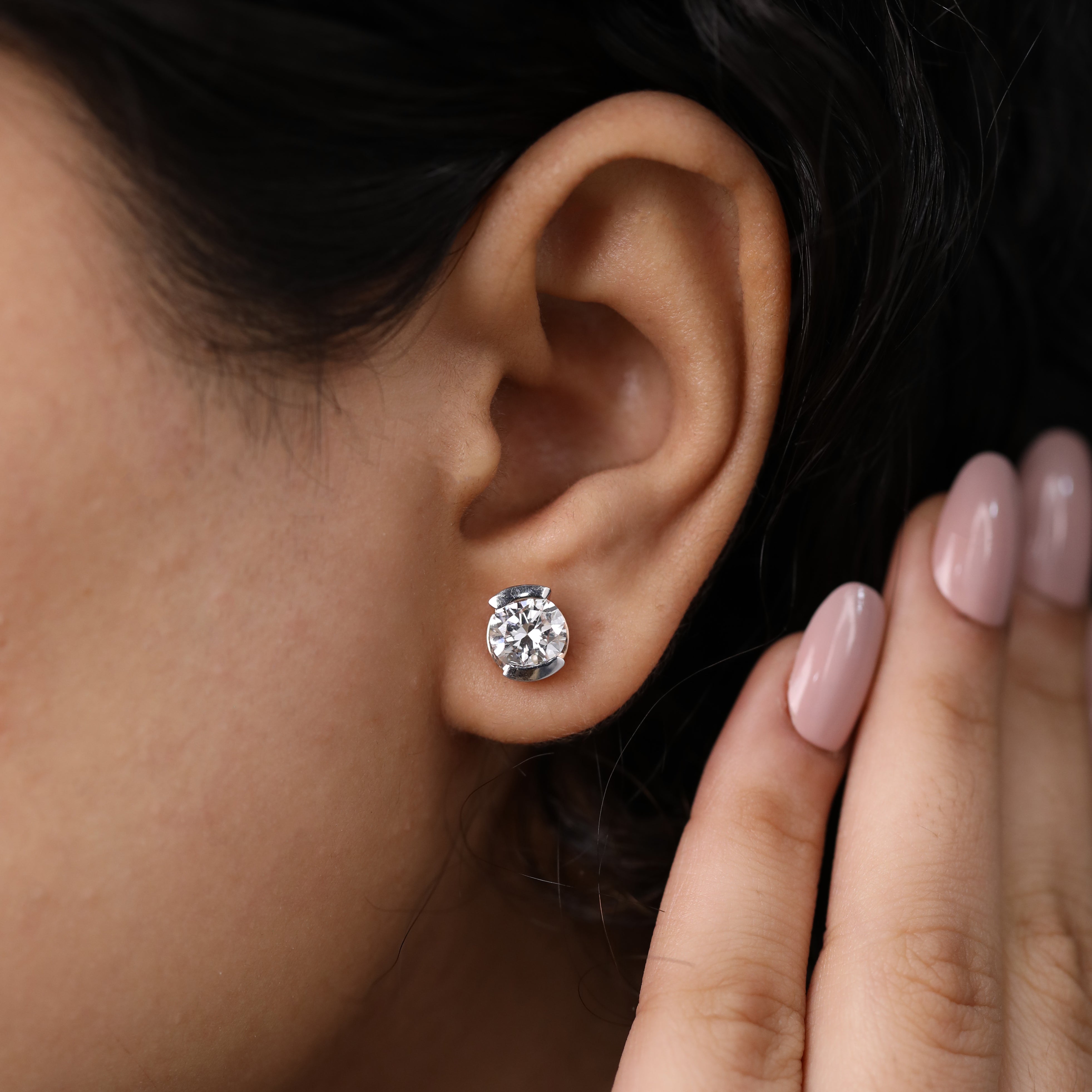 Round diamond half-bezel earrings ideal for wedding and gifting moments.