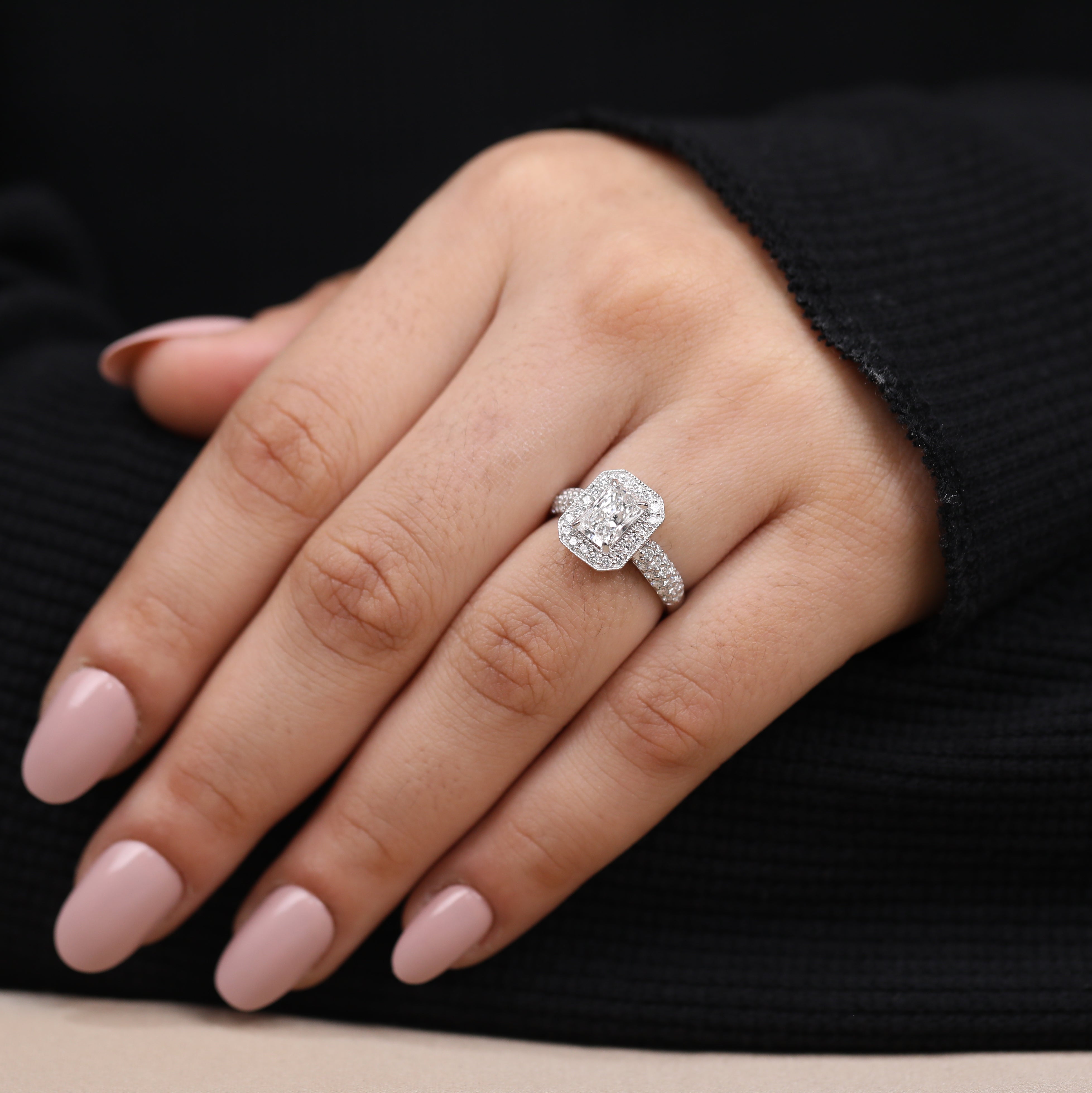 Classic emerald cut lab diamond halo ring with brilliant side accents
