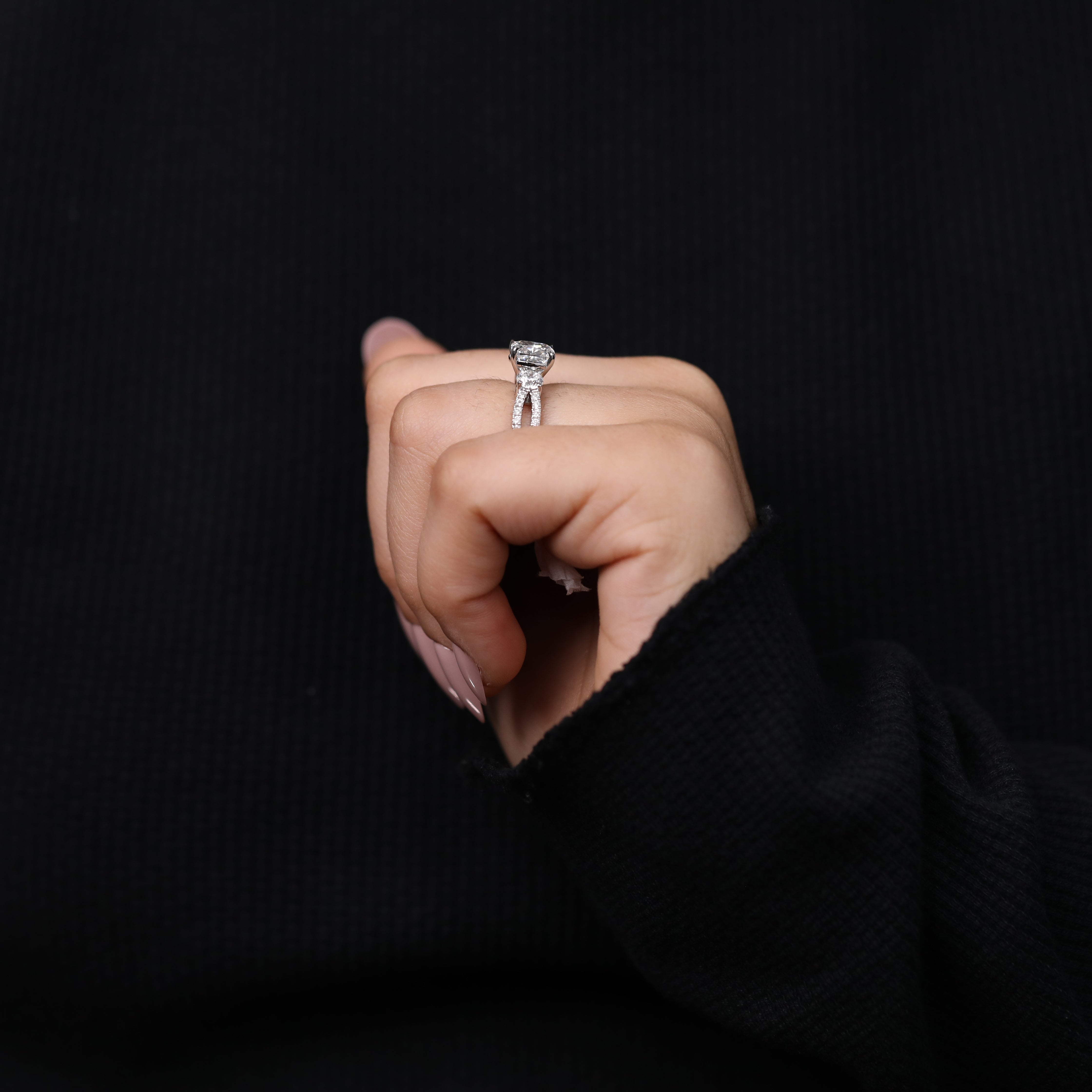 Cushion cut lab diamond ring featuring a classic three stone inspired look