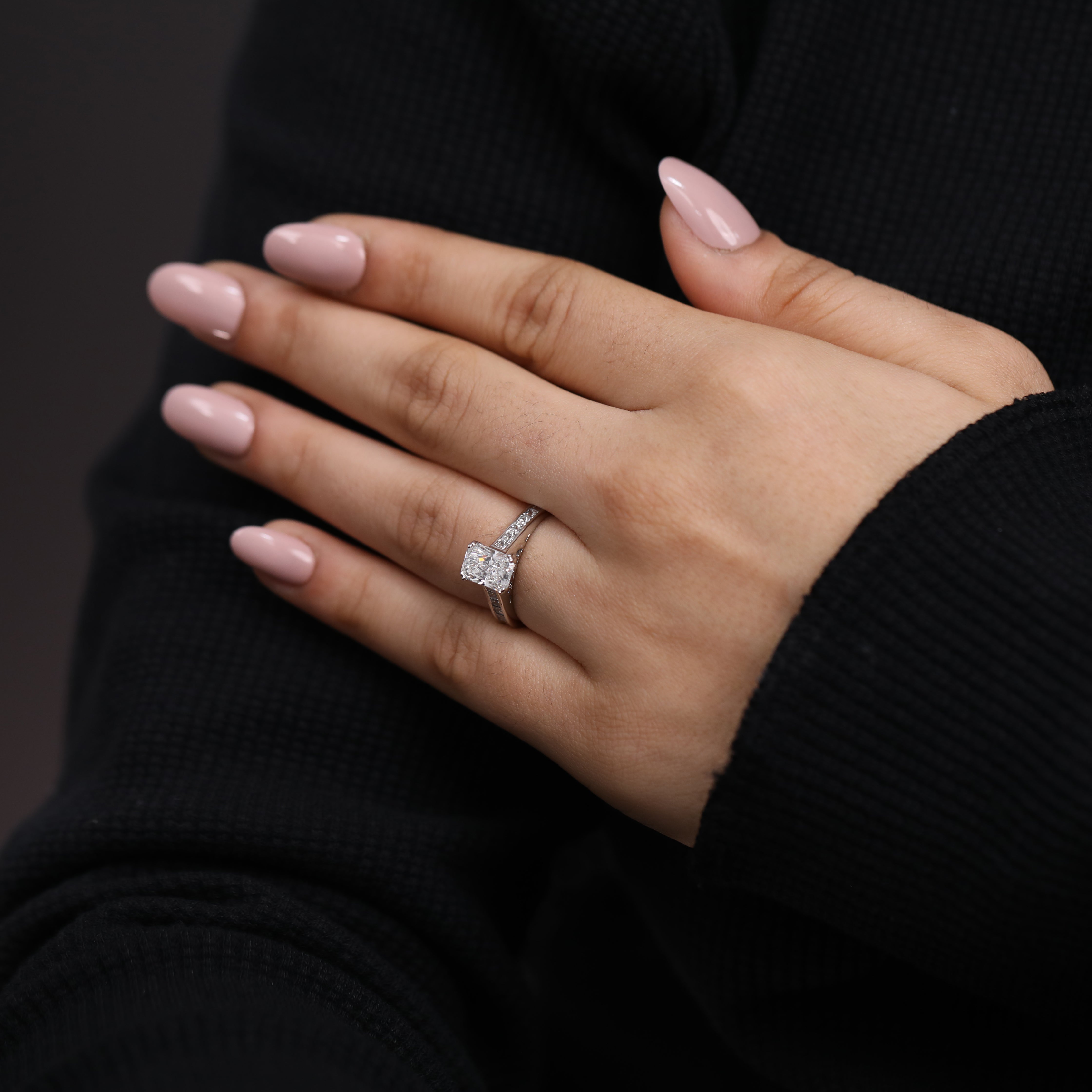 Classic engagement ring featuring a radiant cut lab diamond in vintage style.