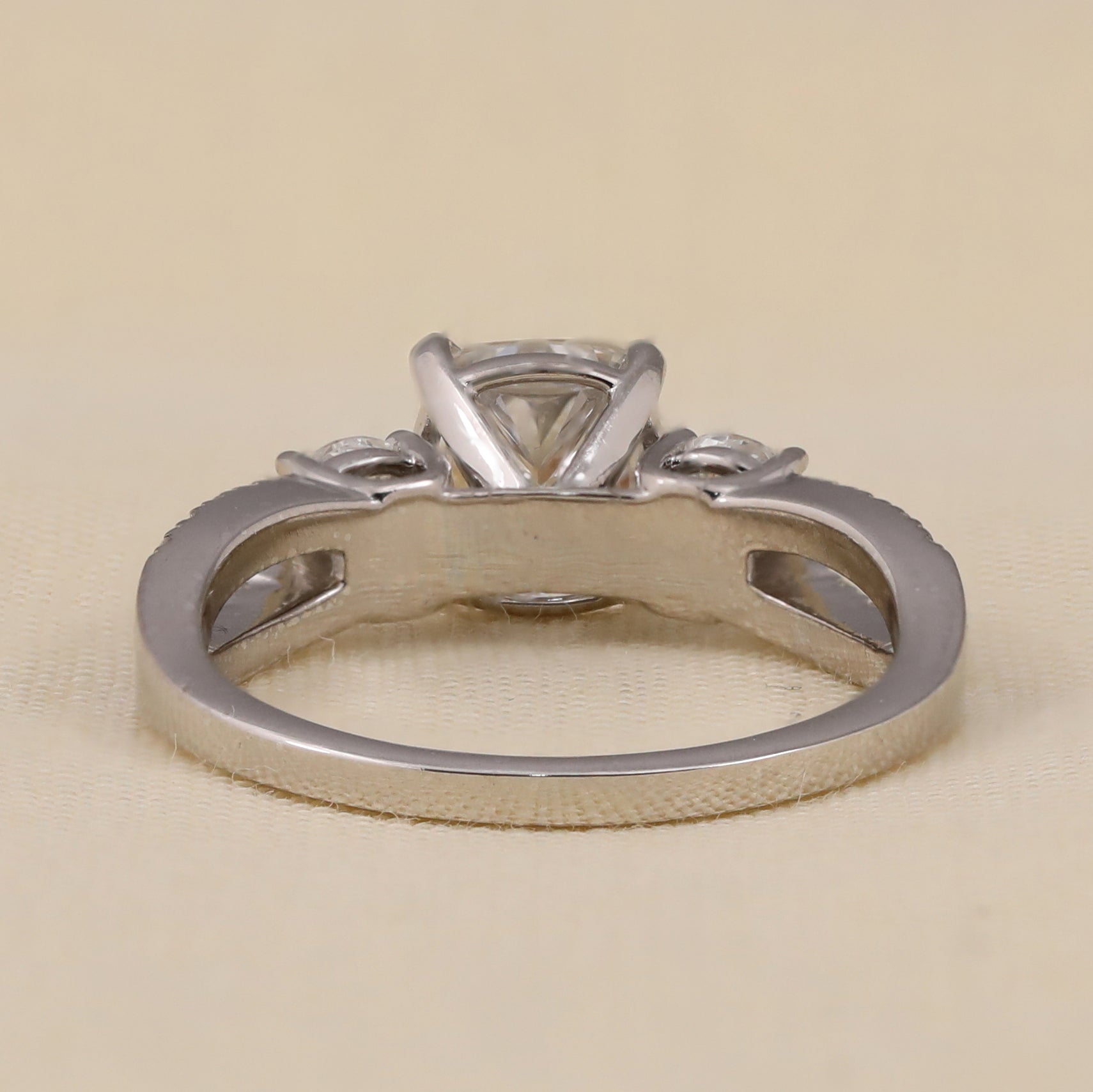 Cushion cut lab diamond ring with sparkling side stones and refined setting