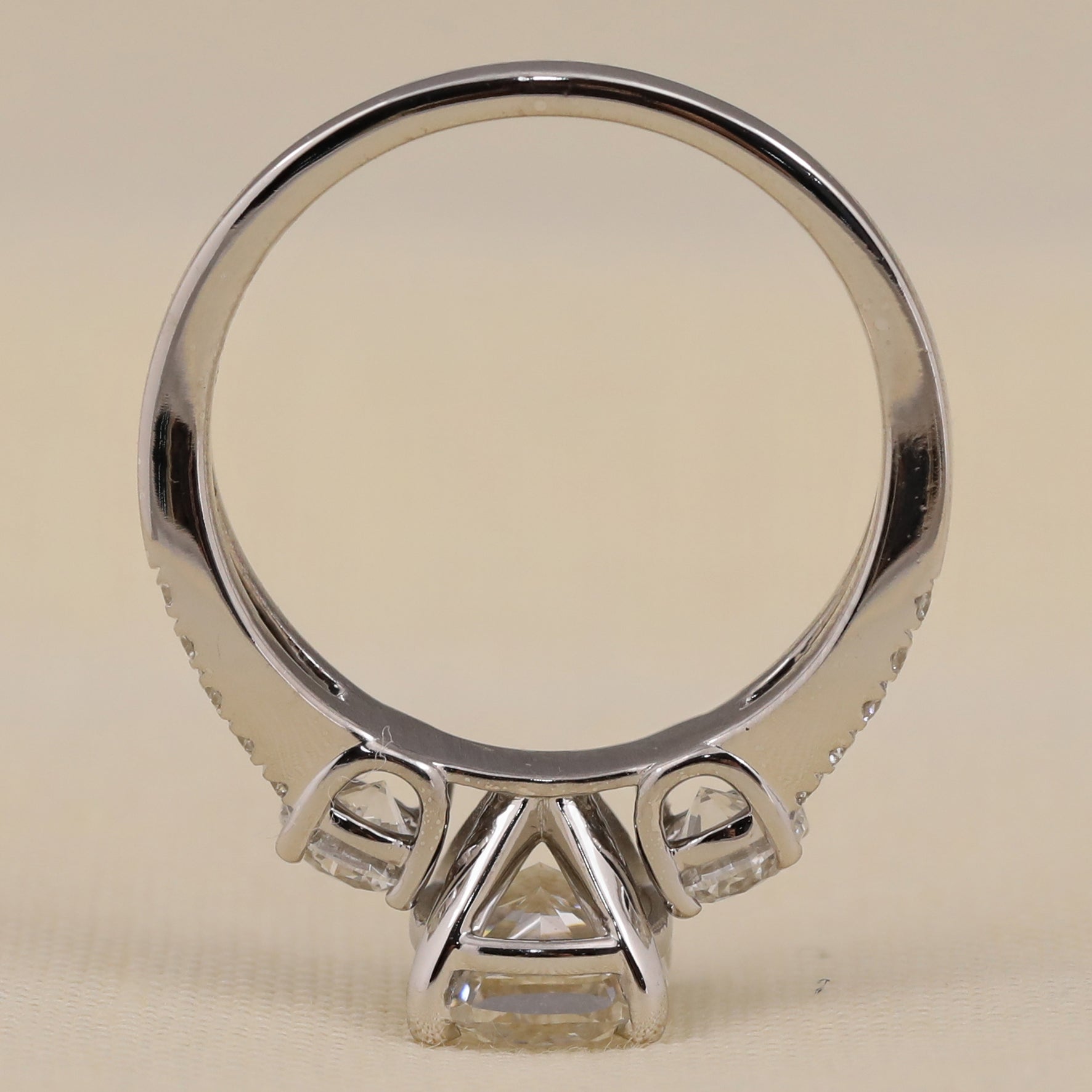 Split shank engagement ring showcasing a cushion cut lab diamond center