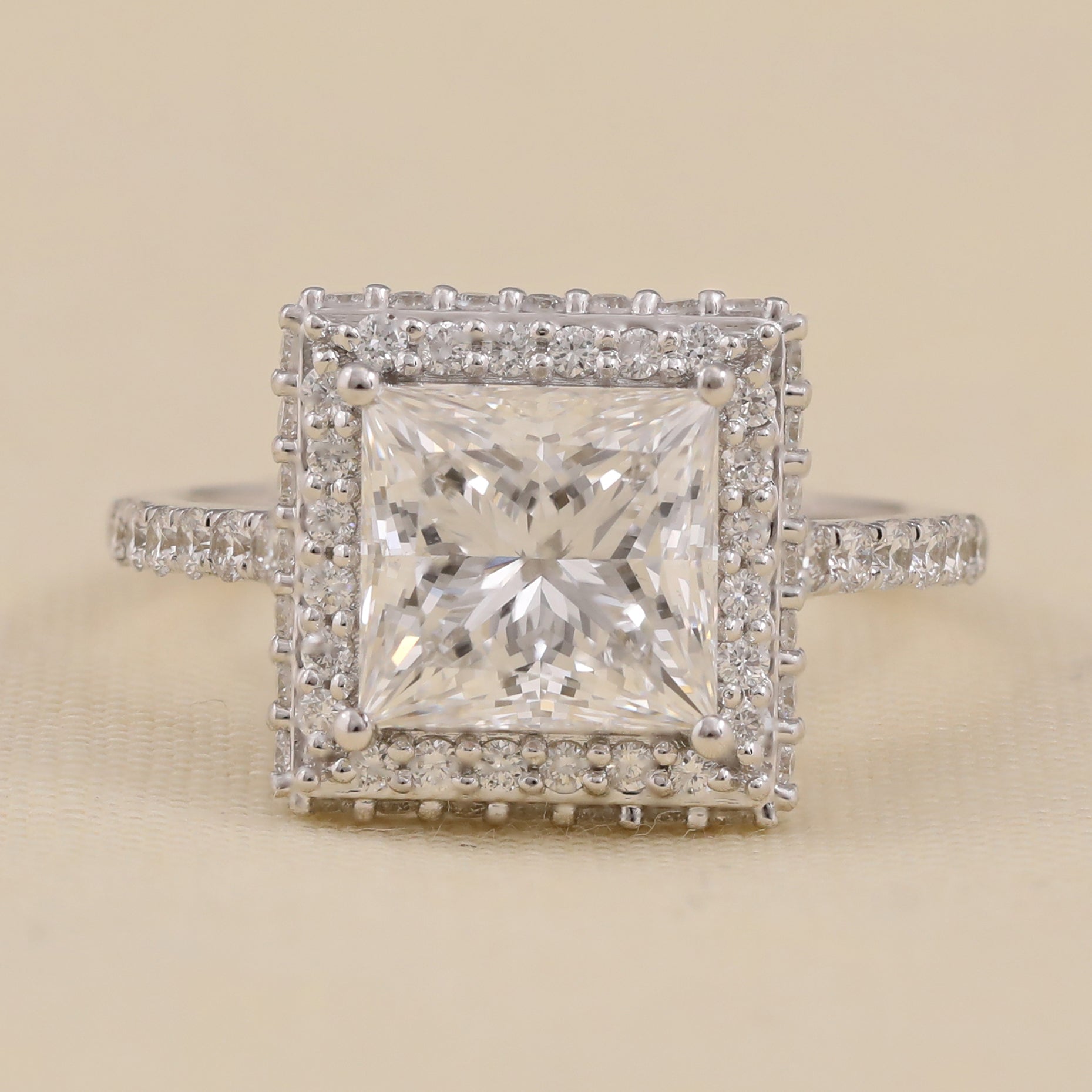 Princess cut lab diamond engagement ring with square halo and diamond band