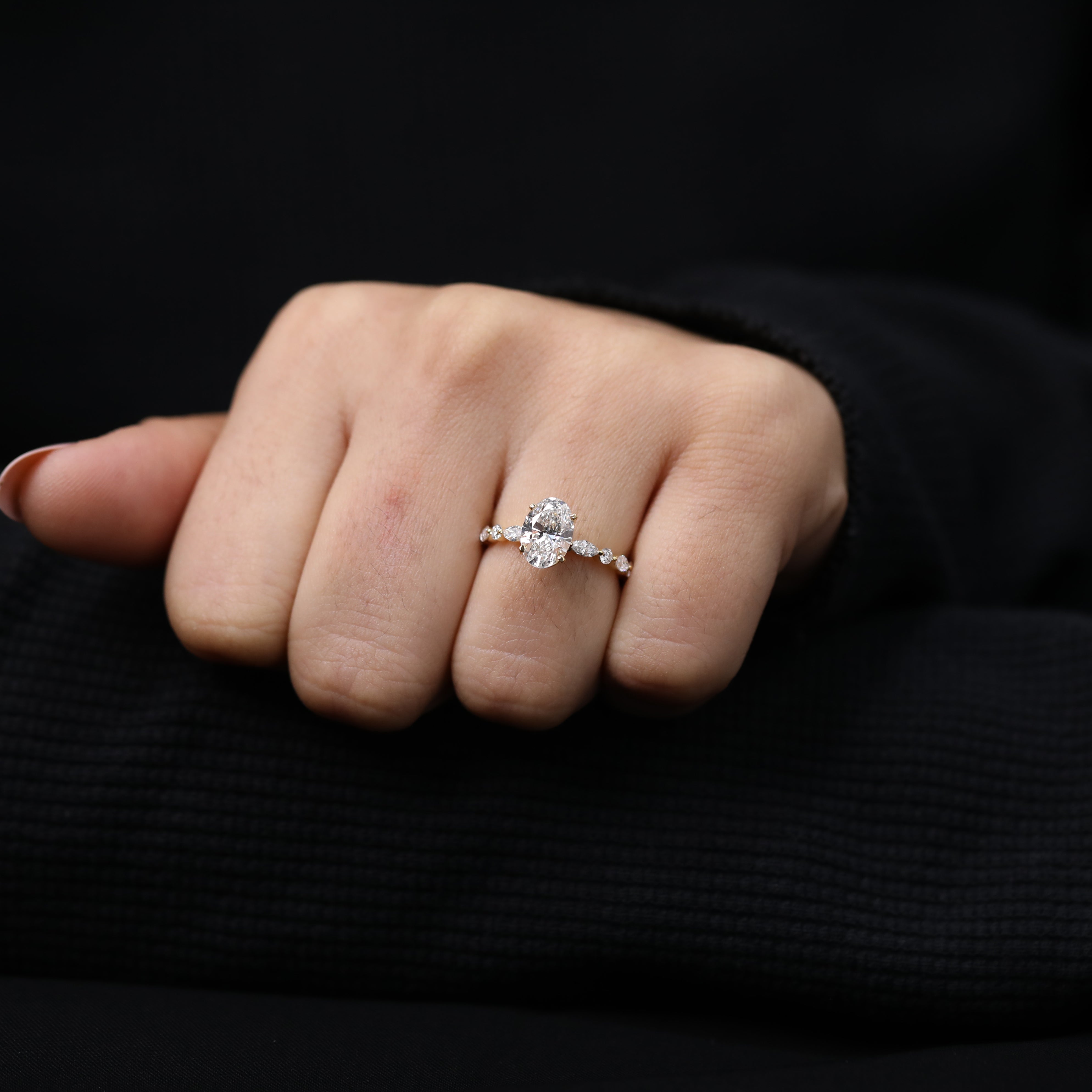 Oval cut lab diamond engagement ring in a vintage inspired setting