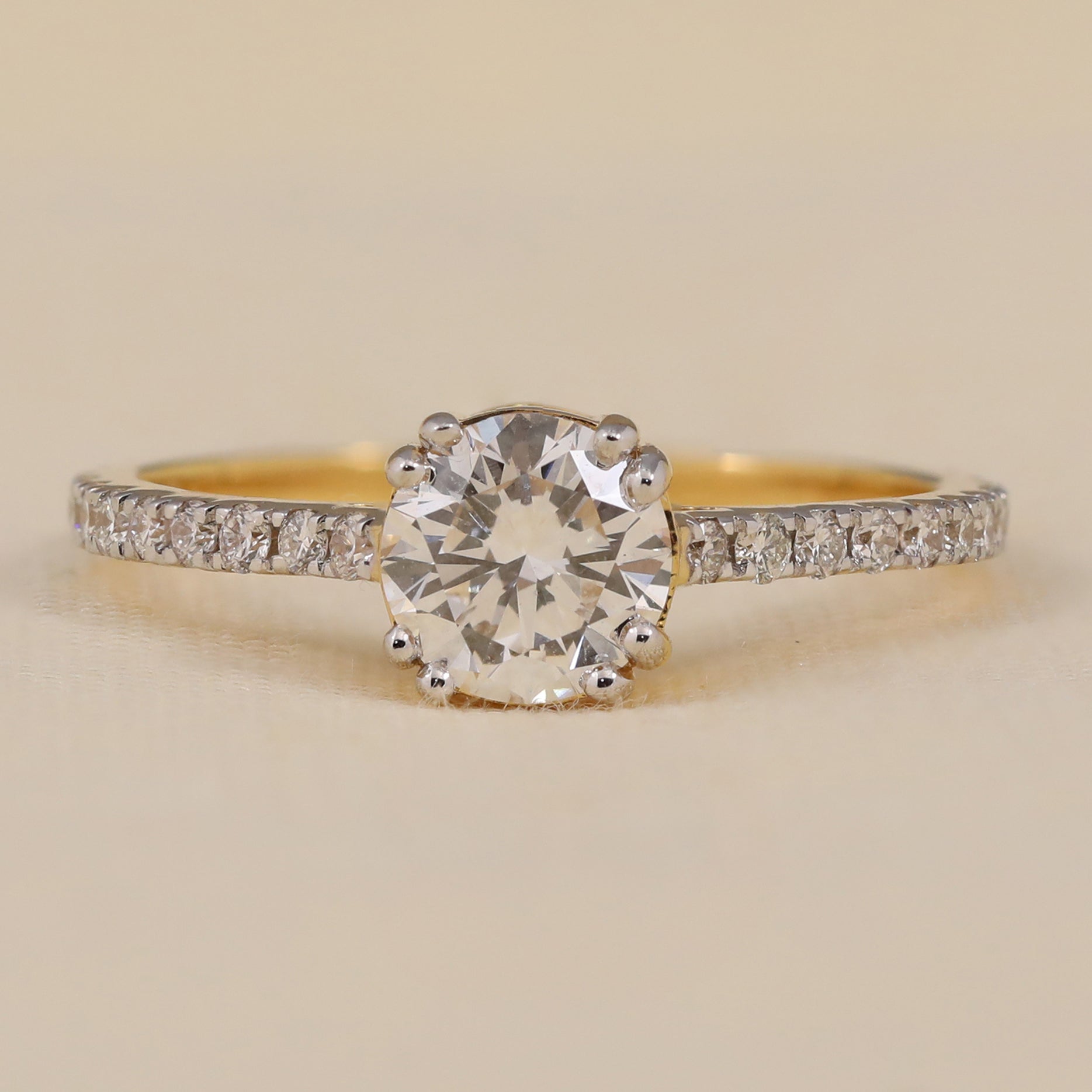 Engagement ring featuring round lab grown diamond pavé solitaire