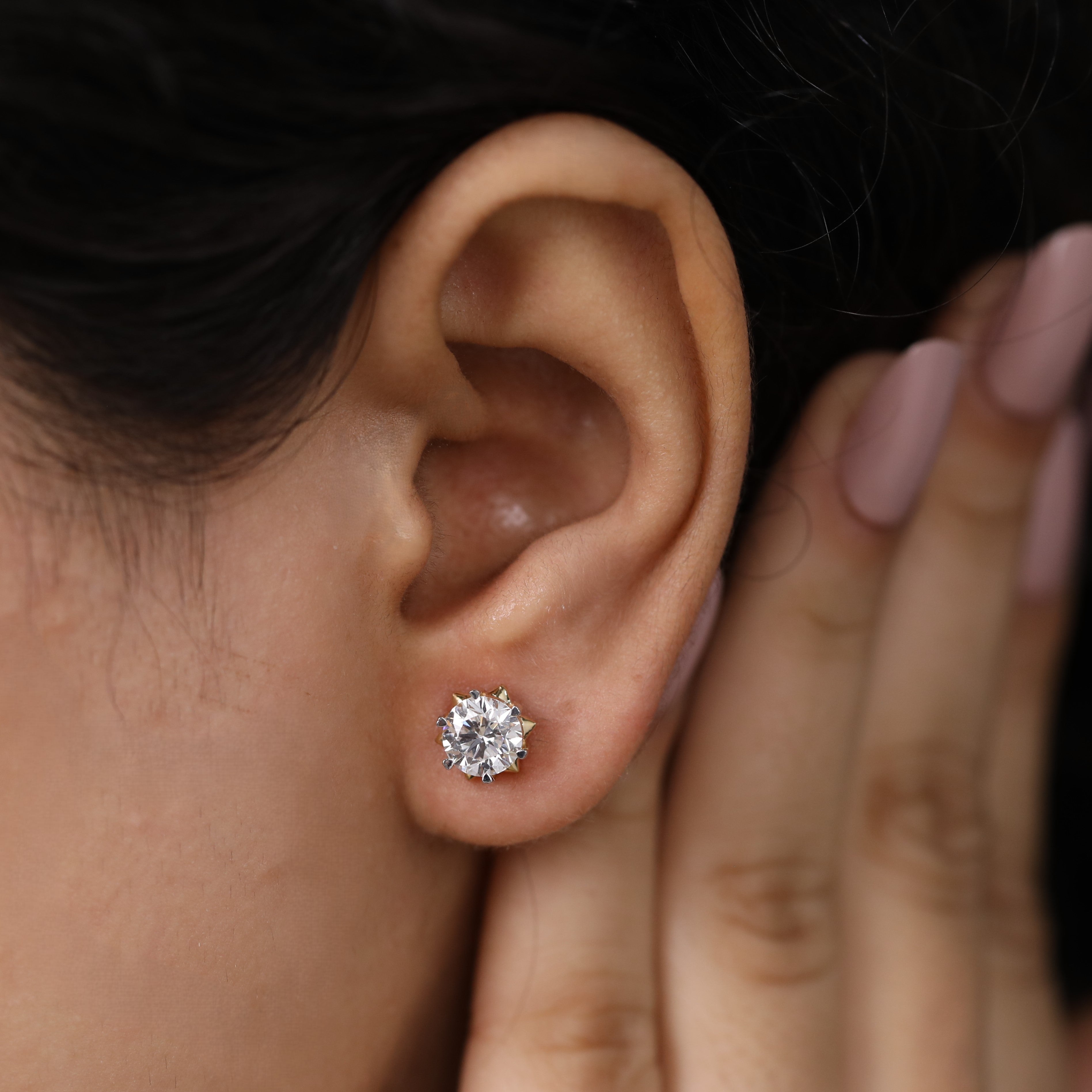 Radiant round diamond studs perfect for engagement or special moments.