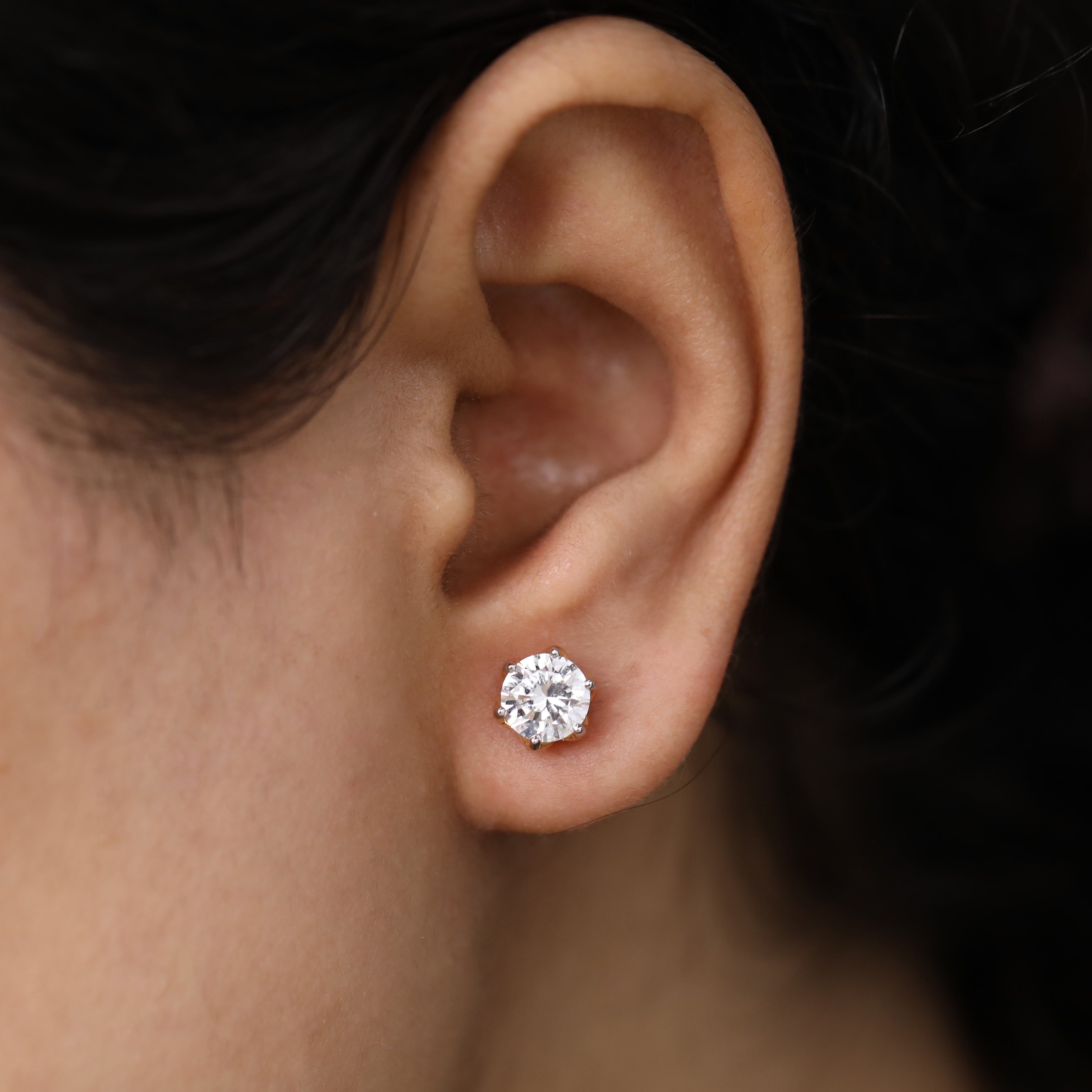 Stylish round diamond earrings suited for anniversary gifting and wedding events.