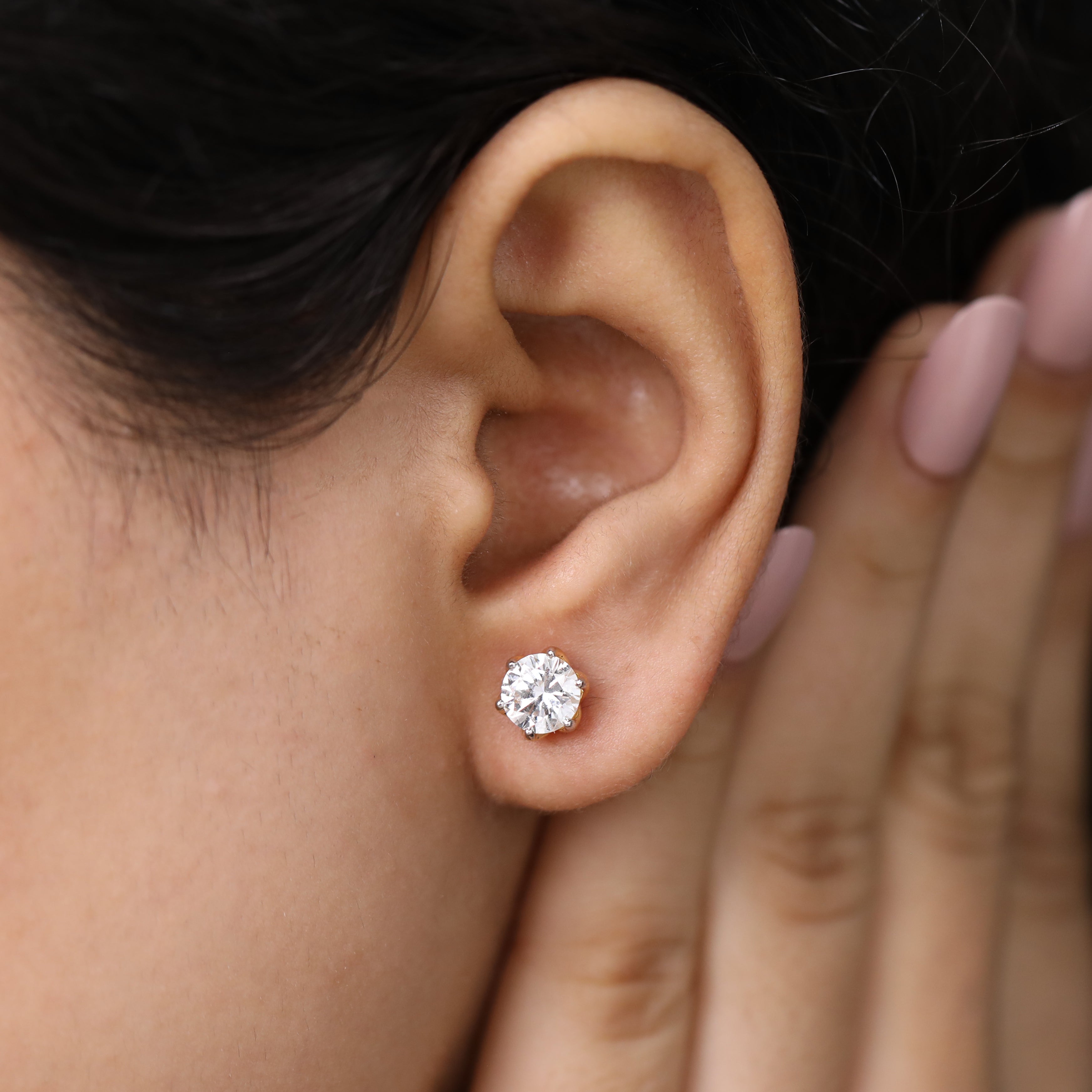Dazzling round-cut diamond studs perfect for party looks and festivals.