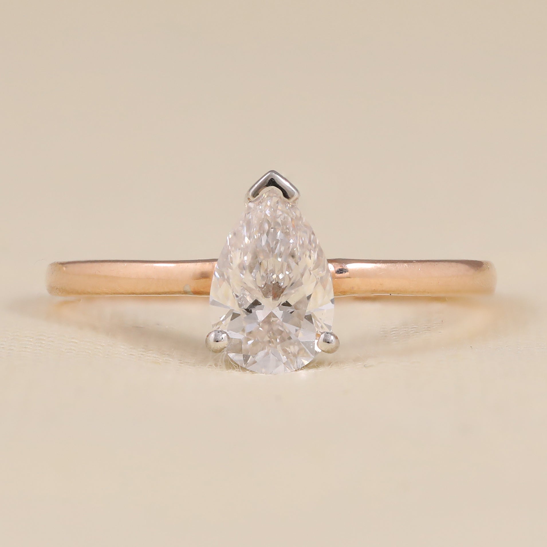 Pear cut lab grown diamond solitaire engagement ring proposal