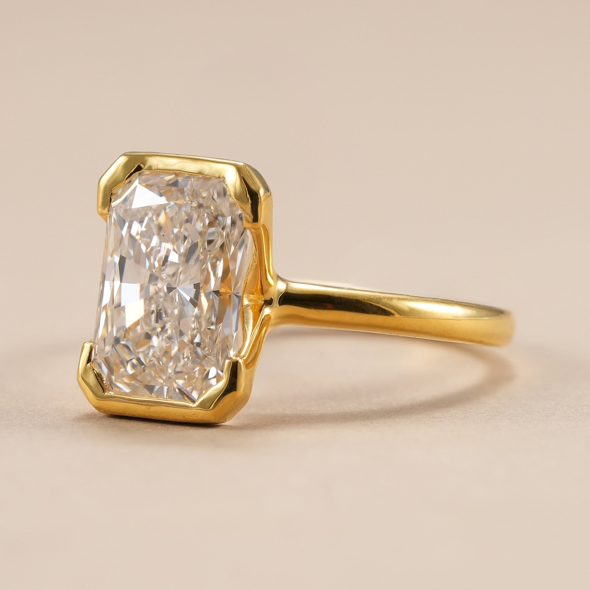 IGI certified radiant cut solitaire engagement ring handcrafted in solid gold.