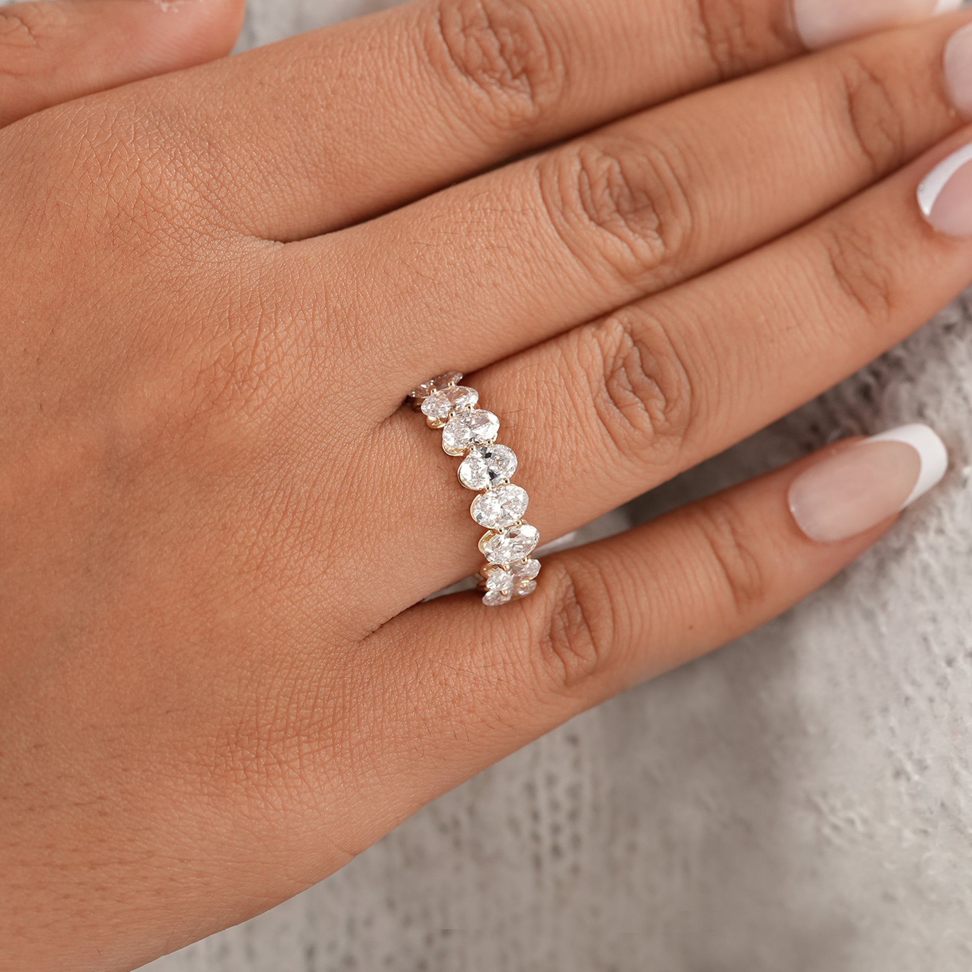 Women's oval diamond wedding band with nine stones