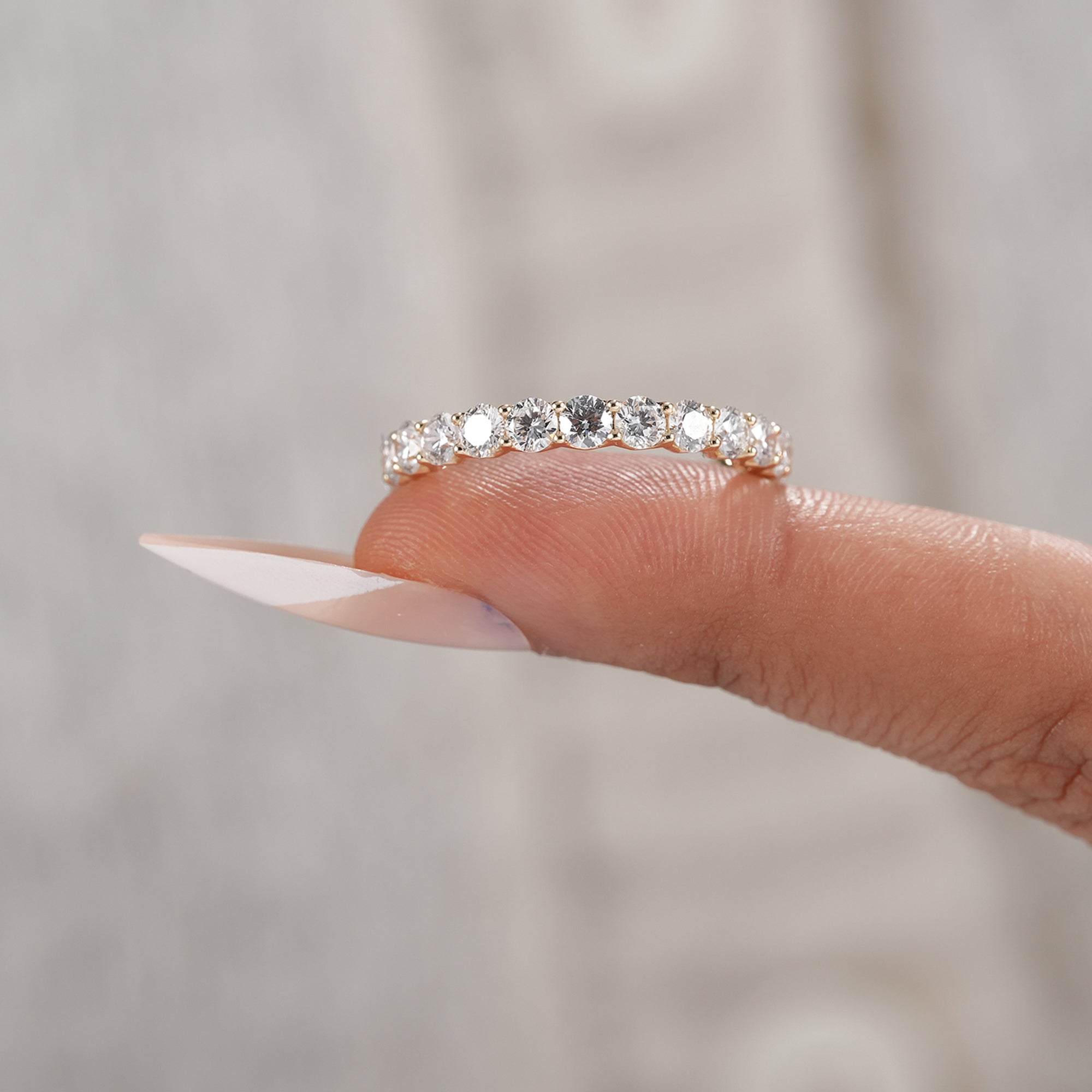 Stackable eternity ring with round brilliant diamonds.