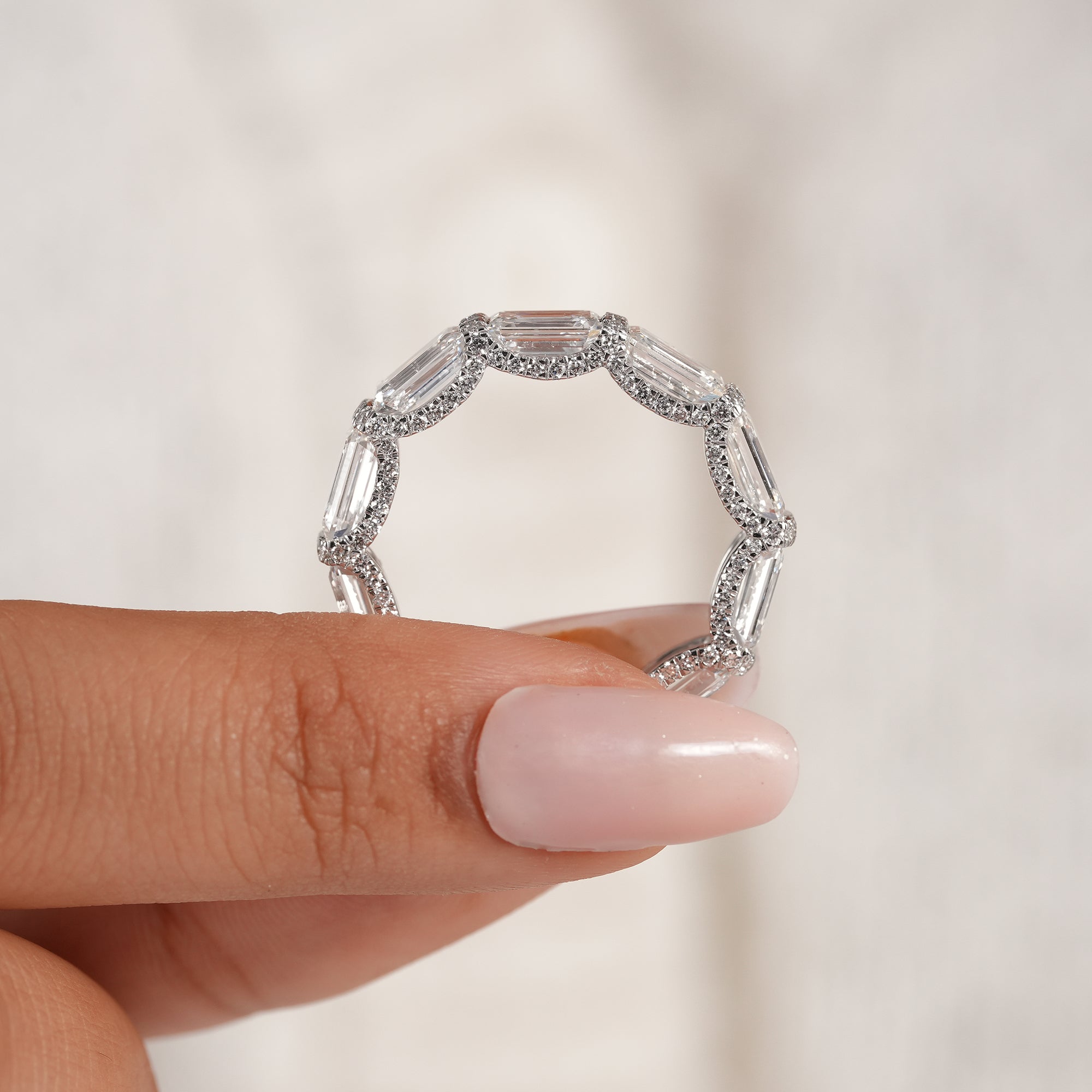 Stackable emerald diamond band with micro pavé detailing.