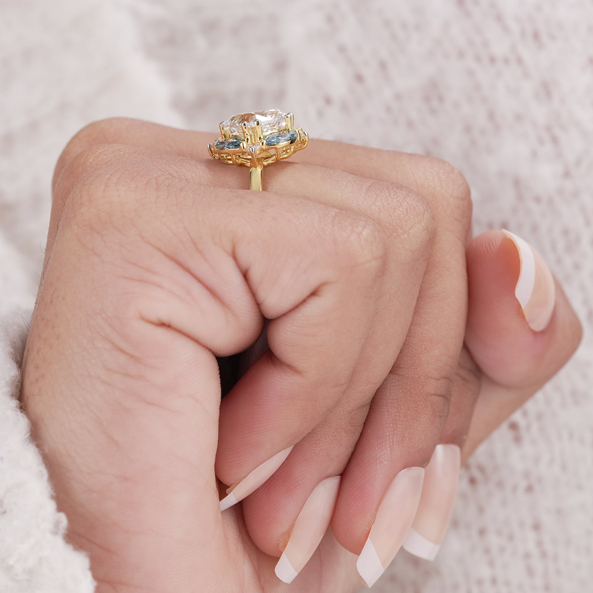 Cushion cut diamond cluster ring with sparkling accents