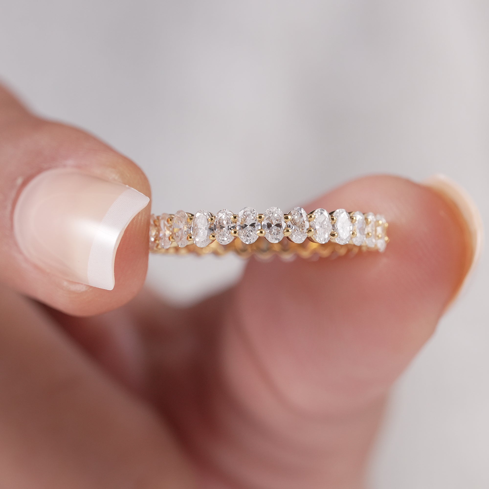 Elegant diamond stacking ring with oval stones.