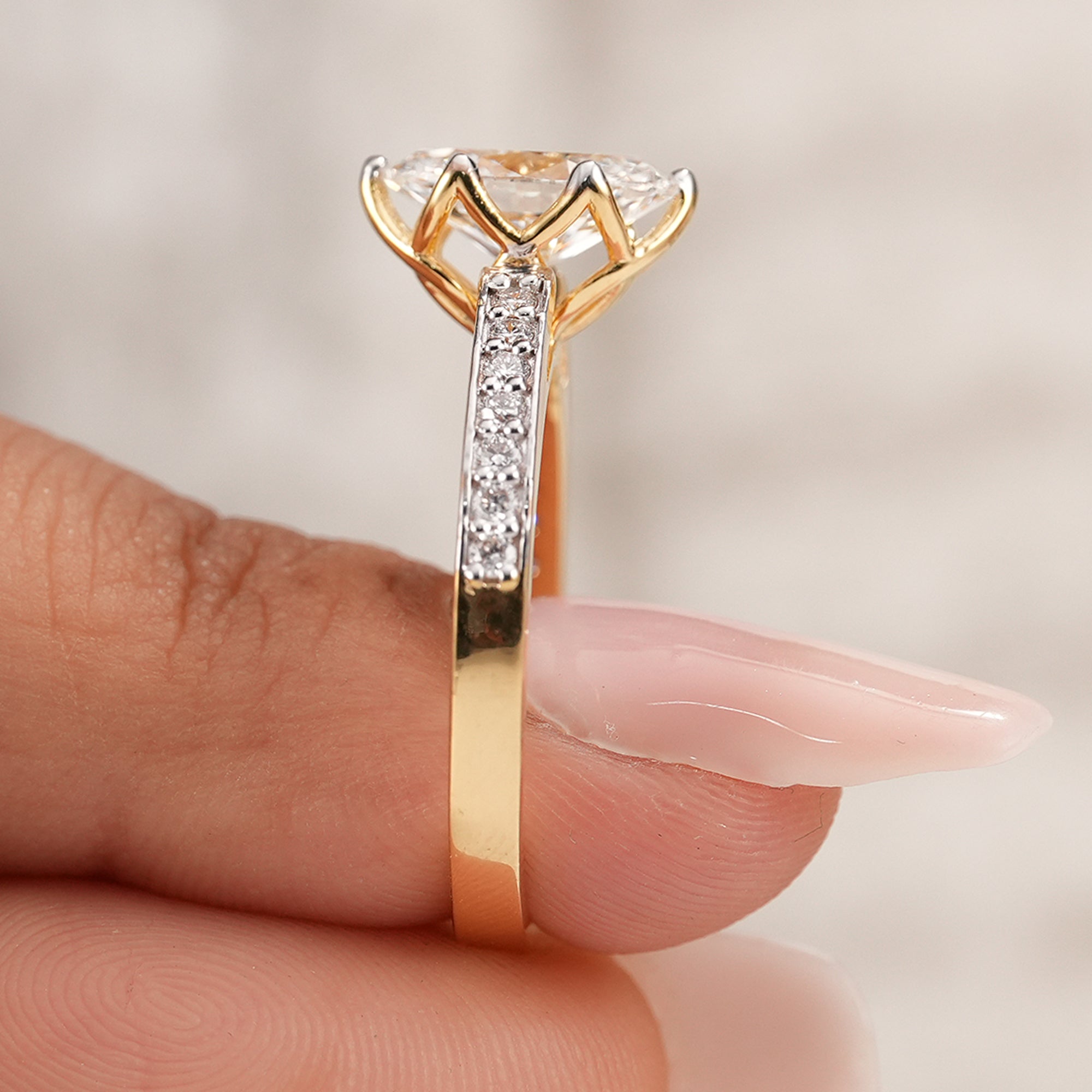 Oval diamond ring with secure prong setting and pavé band