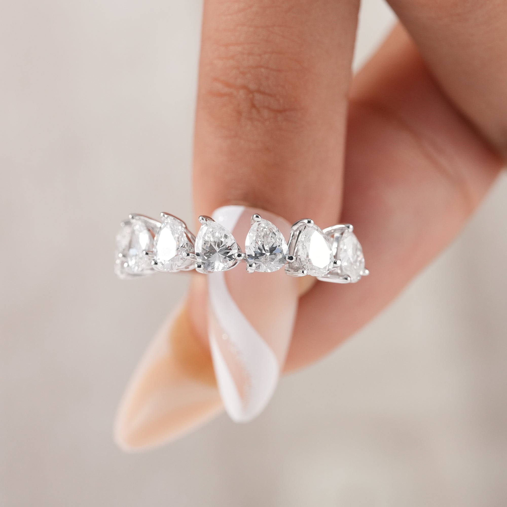Sustainable pear lab grown diamond eternity band.
