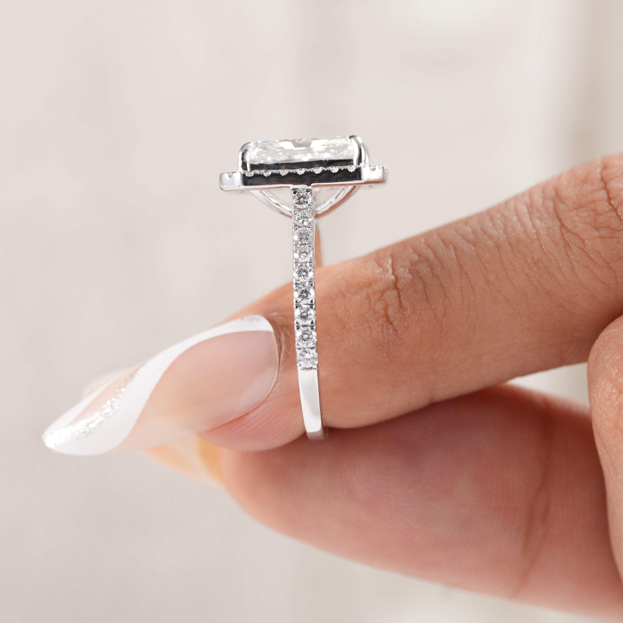 Radiant diamond bridal jewelry with pavé band.