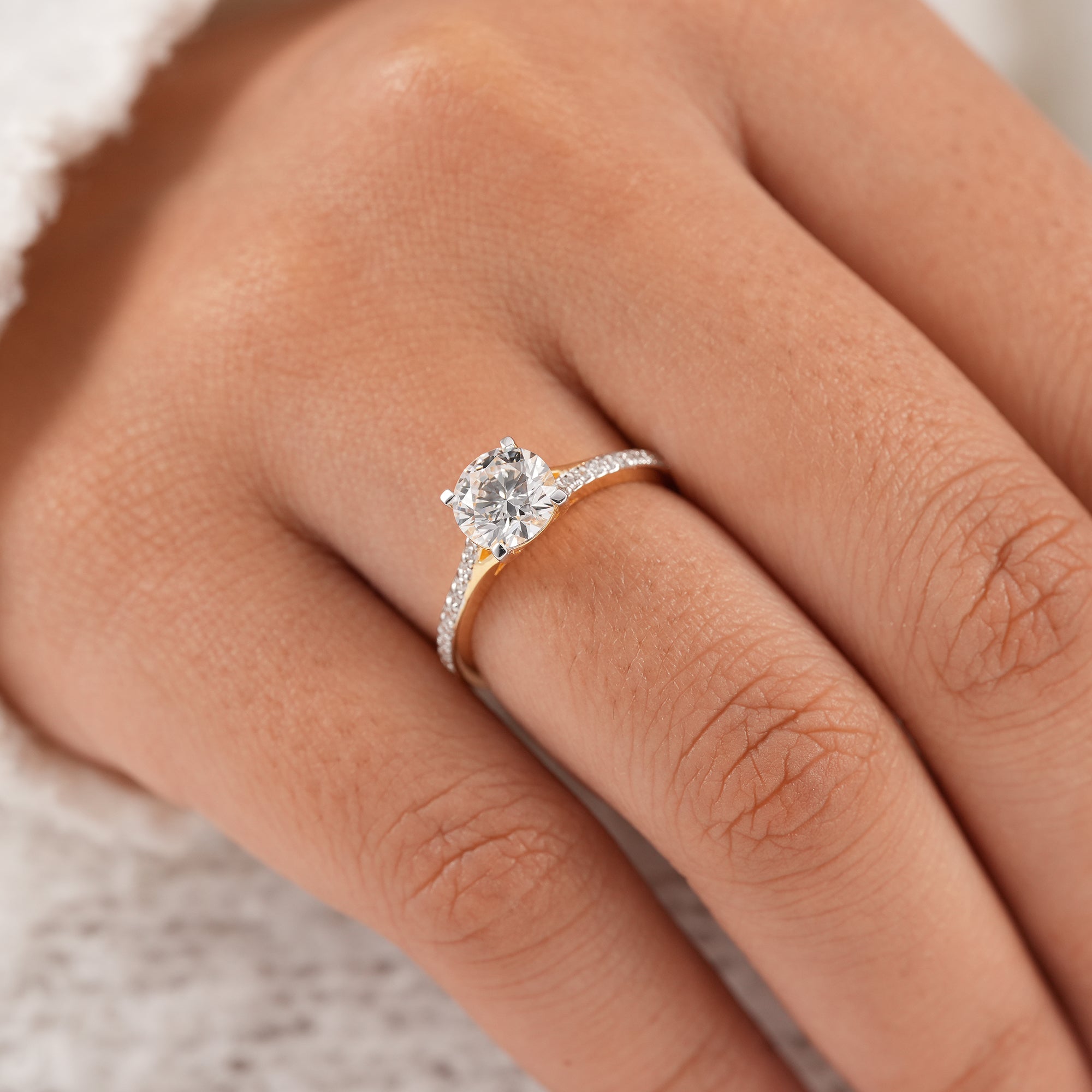 Cathedral setting round diamond ring with pavé accents
