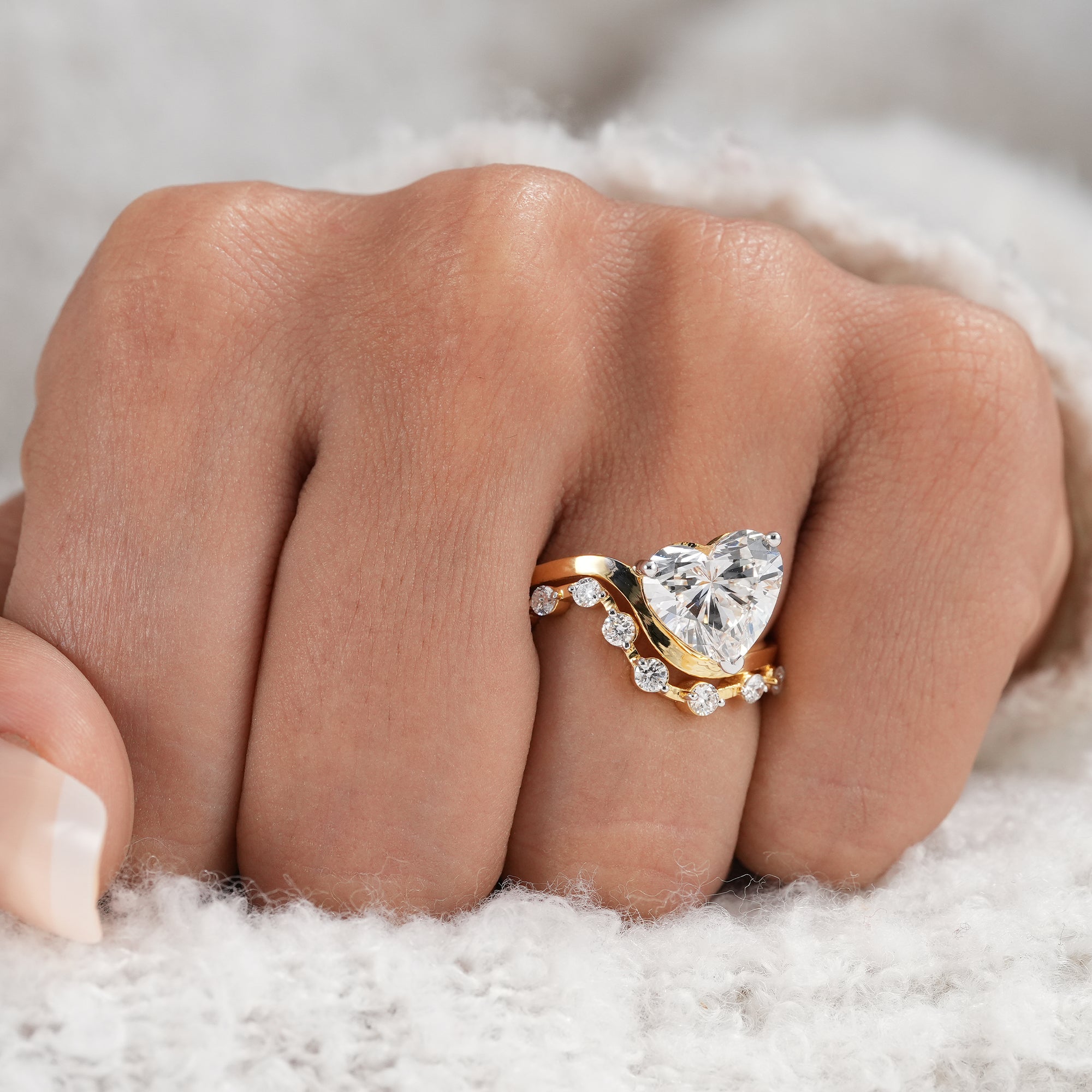 Heart shaped lab diamond bridal ring with open gallery setting.