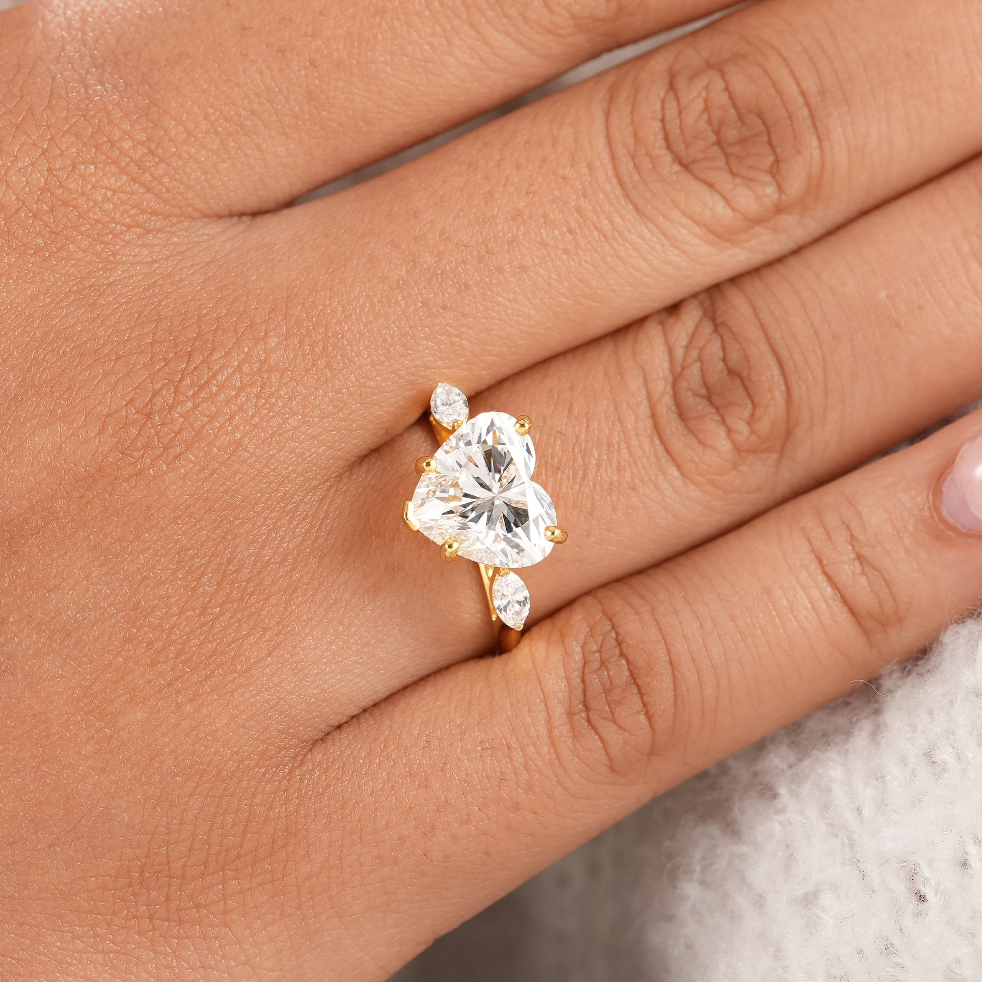 Handmade heart shaped bridal ring with lab grown diamonds.