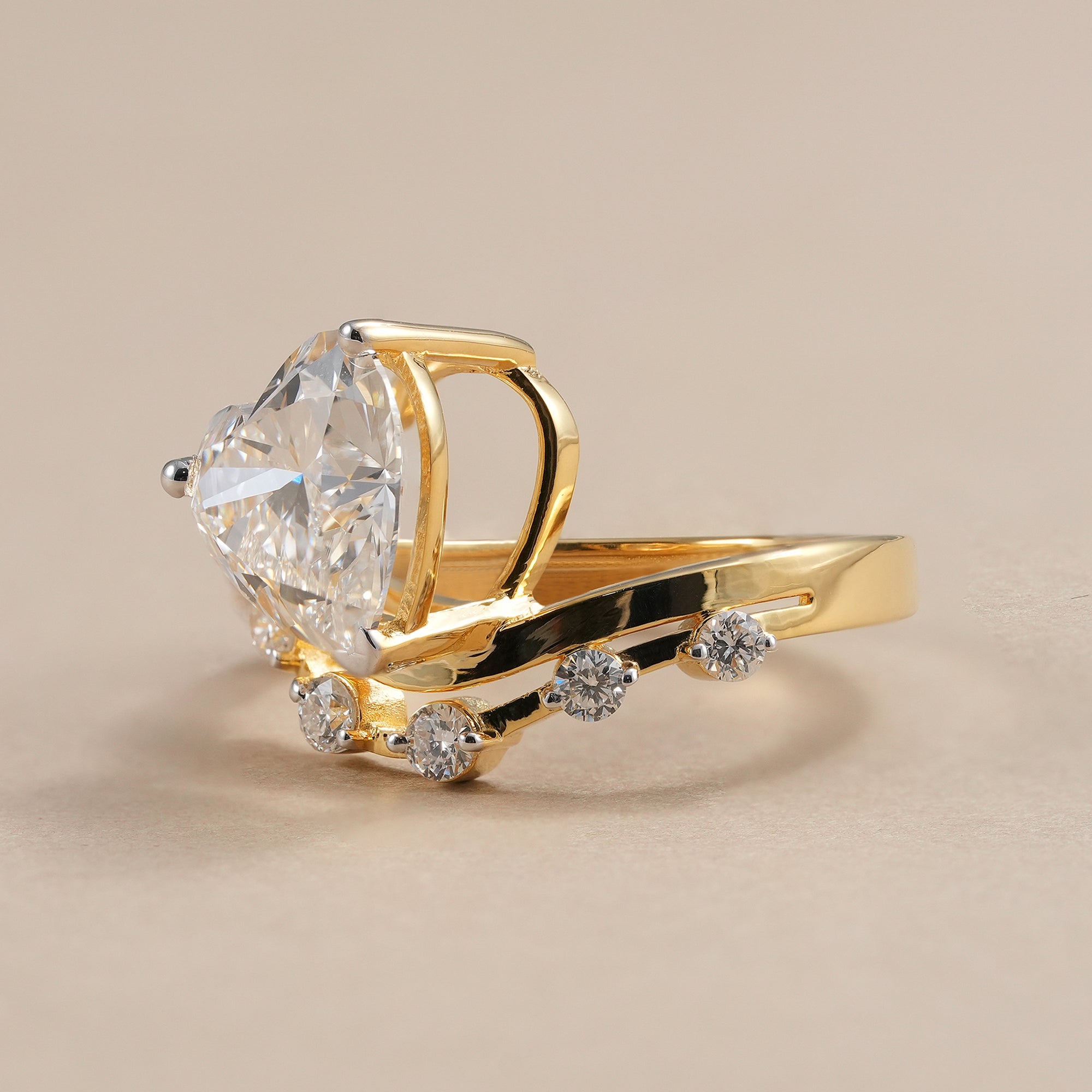 Heart shaped lab grown diamond engagement ring with curved diamond band.
