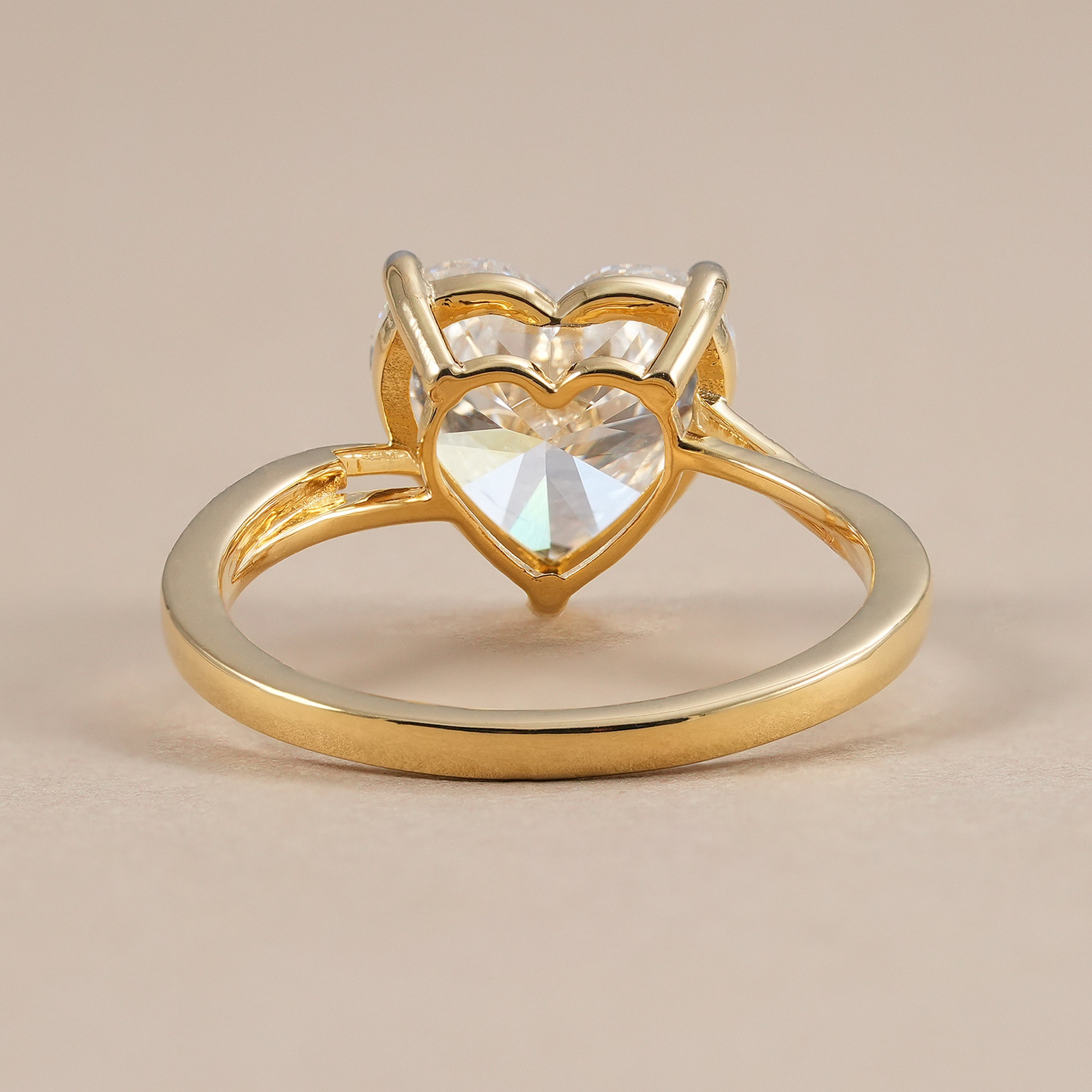 Yellow gold heart cut solitaire lab grown diamond ring.