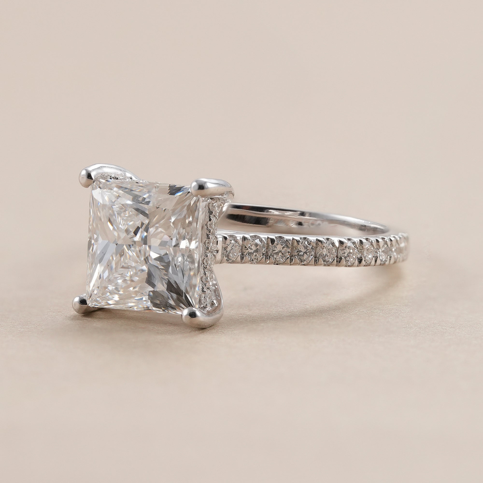 IGI certified princess cut lab diamond engagement ring with hidden halo.