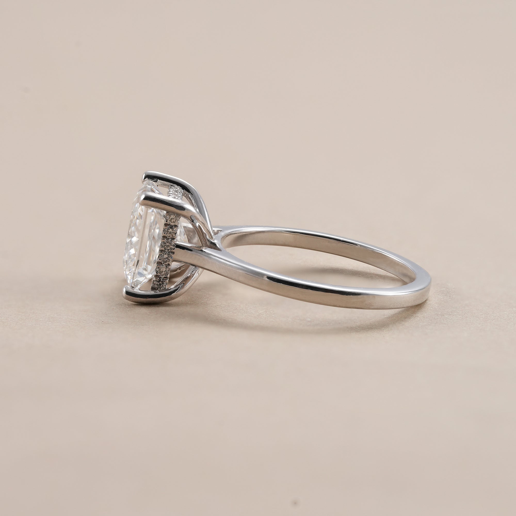 Elegant princess cut hidden halo engagement ring with lab grown diamond.